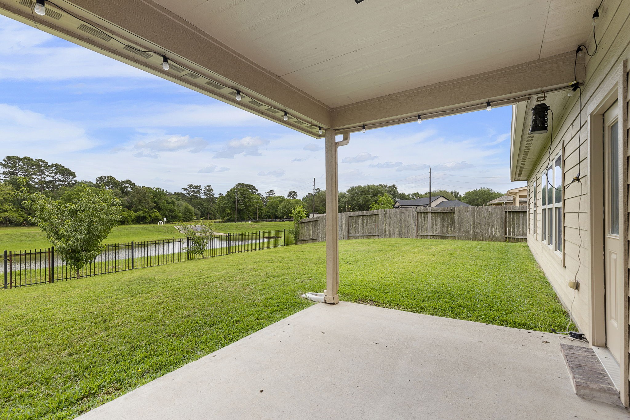 Covered back porch is a great space to relax and enjoy your water and nature views.