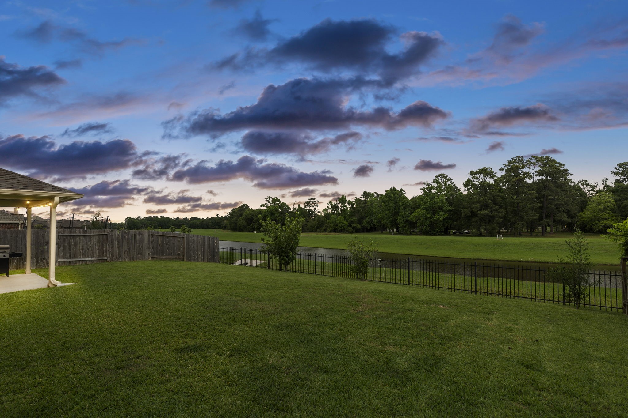 Rain or shine, sunrise or sunset, this backyard was designed for relaxing and perfect for entertaining.
