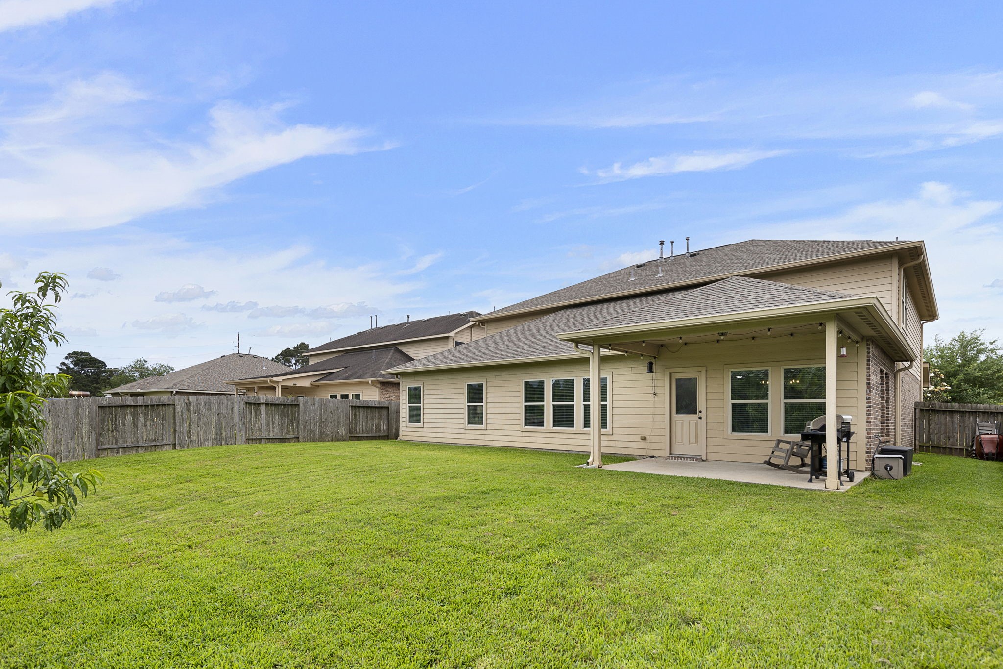 This large backyard offers plenty of space for a trampoline or playset and still enough room to run around!