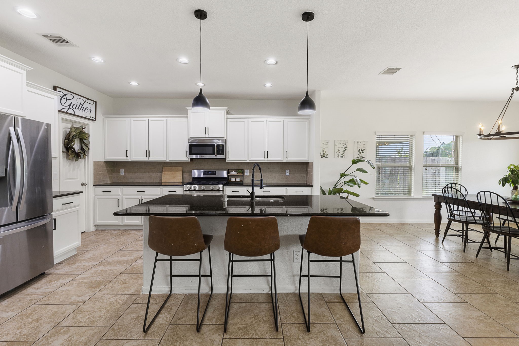 Oversized island with easy eat-in option plus tons of additional counter and cabinet space in this large kitchen.