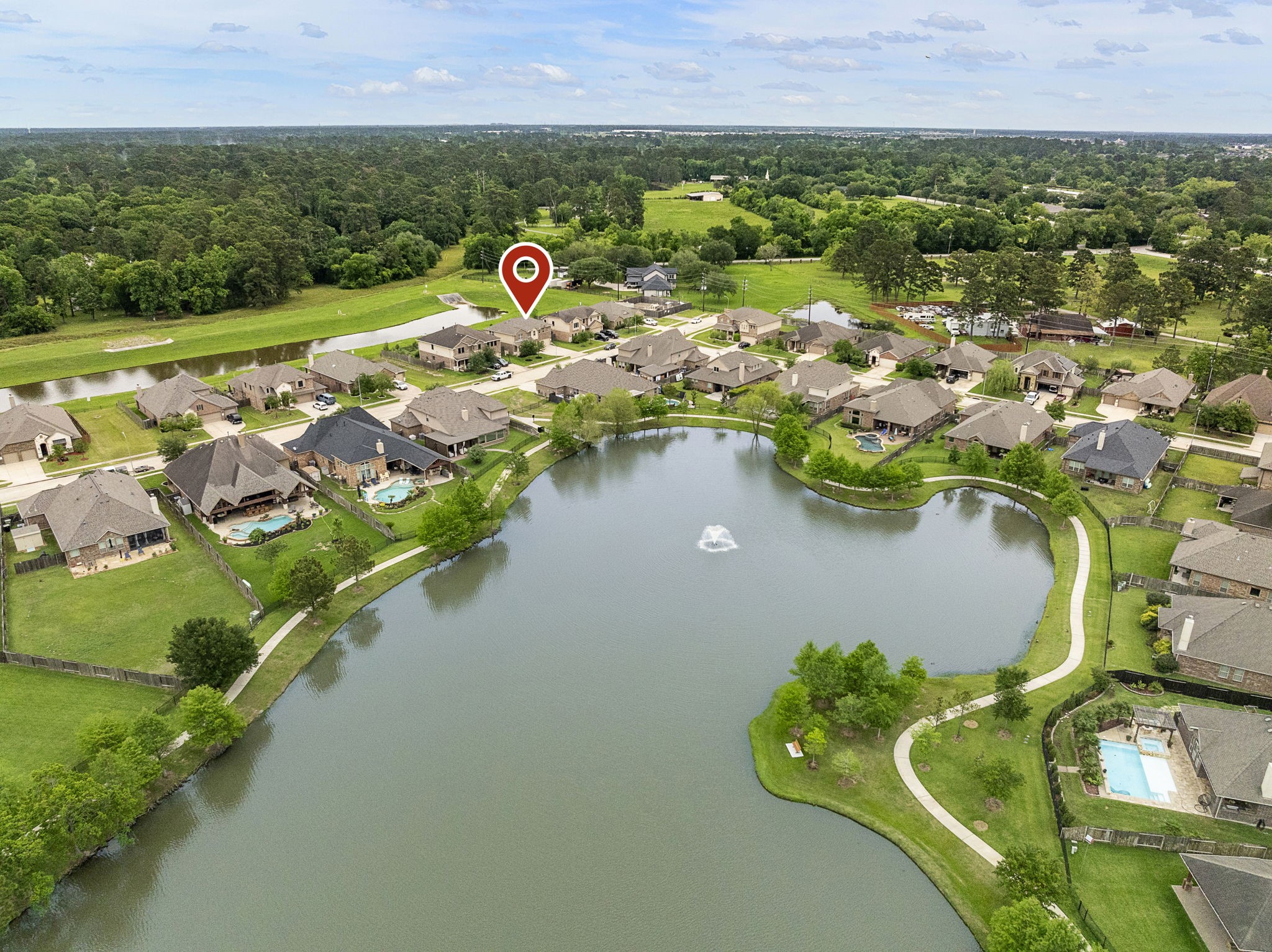 Not only does this house back to water, it is also just across the street from a huge fish-stocked lake with walking trails! Not only does this house back to water, it is also just across the street from a huge fish-stocked lake with walking trails!