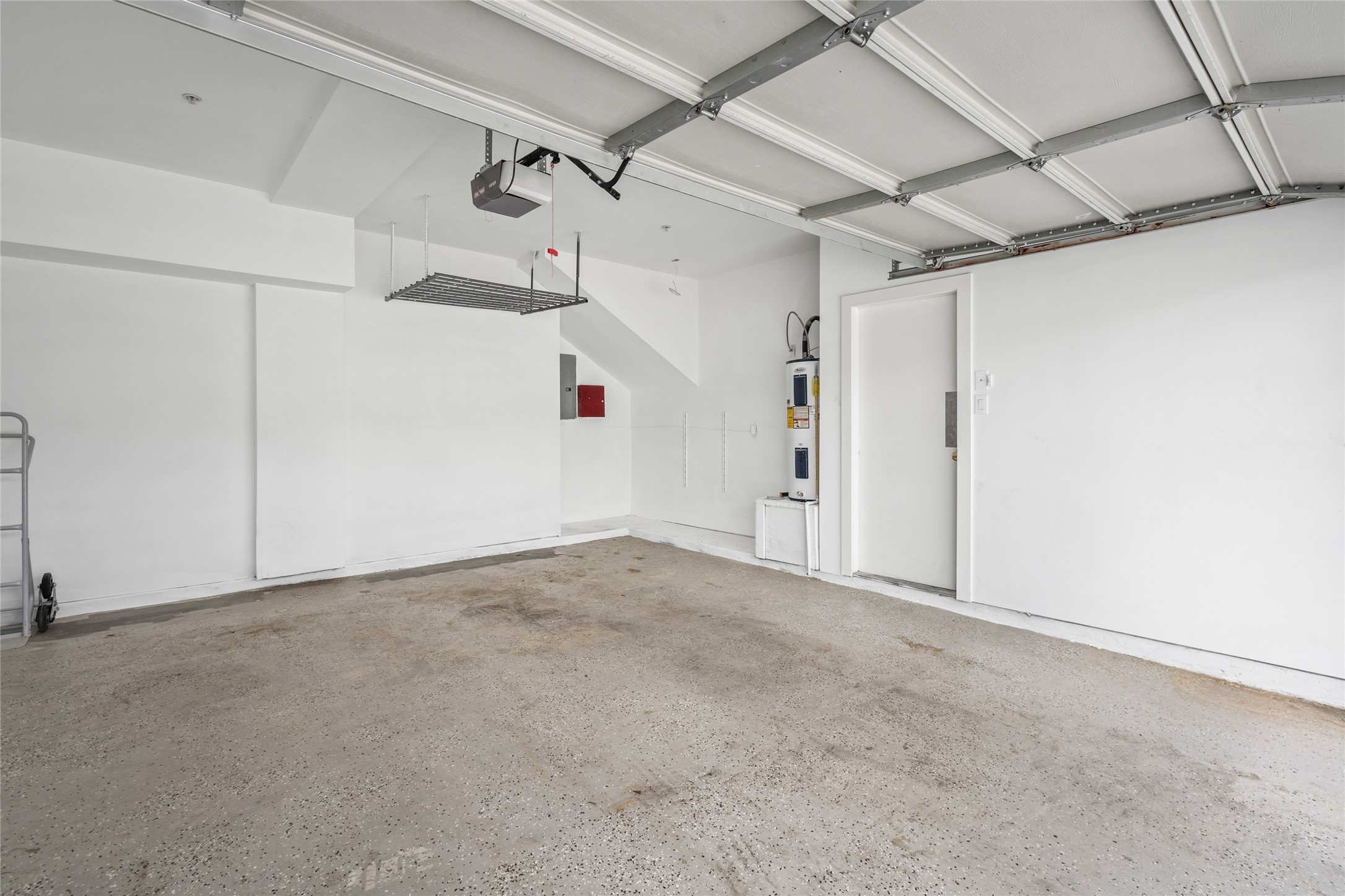 Spacious garage offering secure parking and additional storage, providing both convenience and functionality.