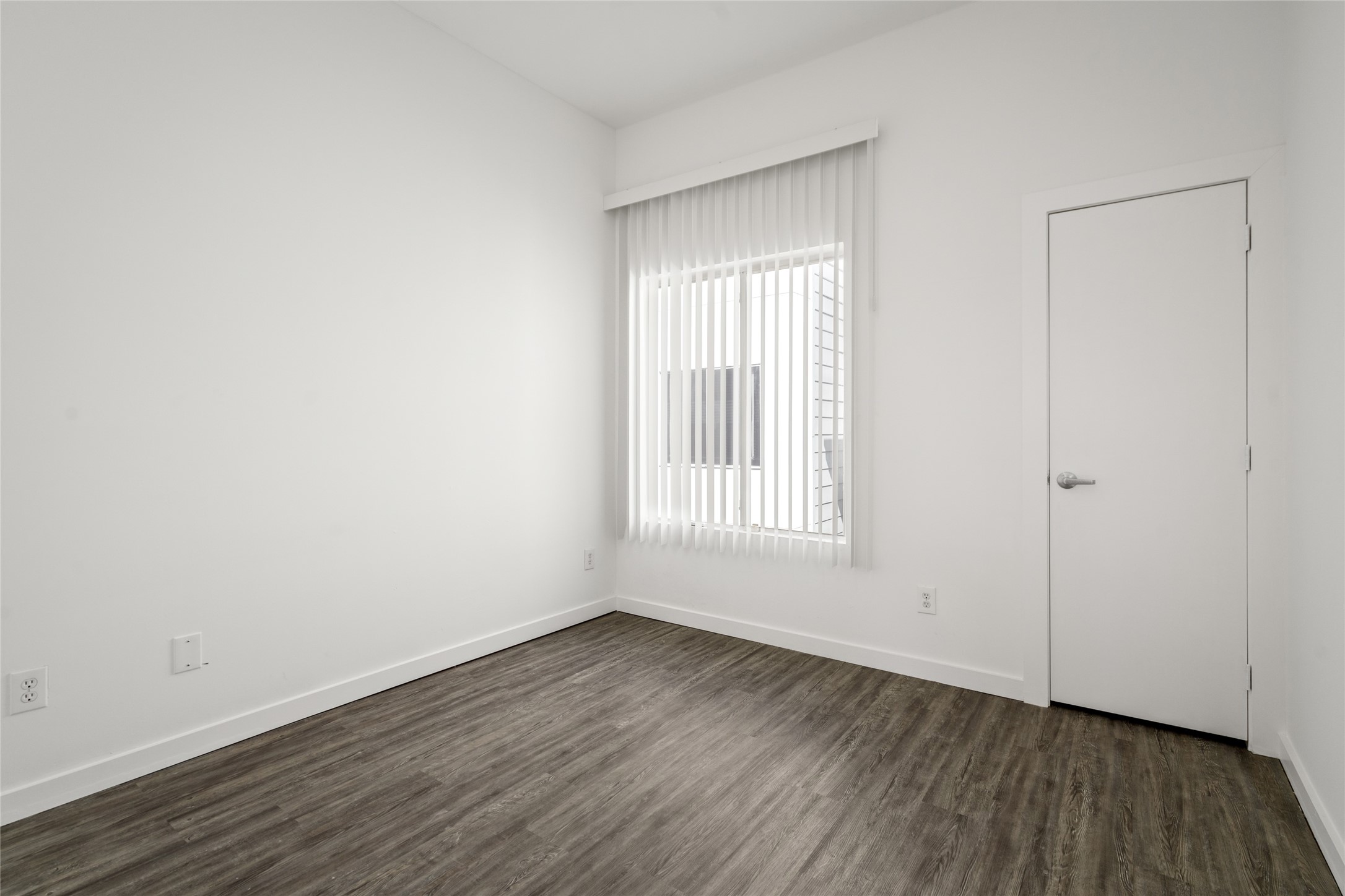 Cozy secondary bedroom providing a versatile space, perfect for guests, a home office, or a personal retreat, with plenty of room to create your ideal environment.