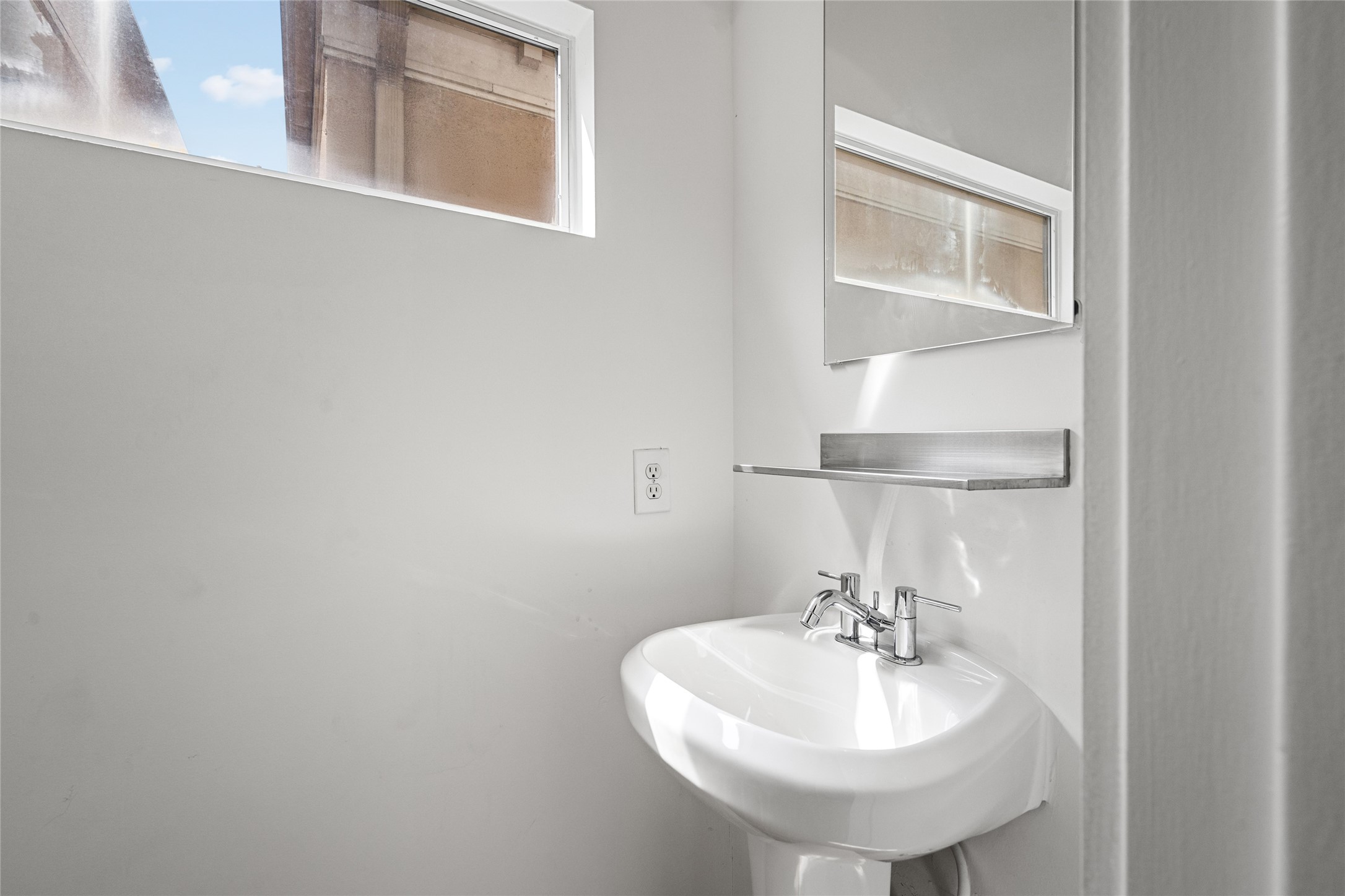 Convenient half bath offering style and functionality, perfect for guests and everyday use.