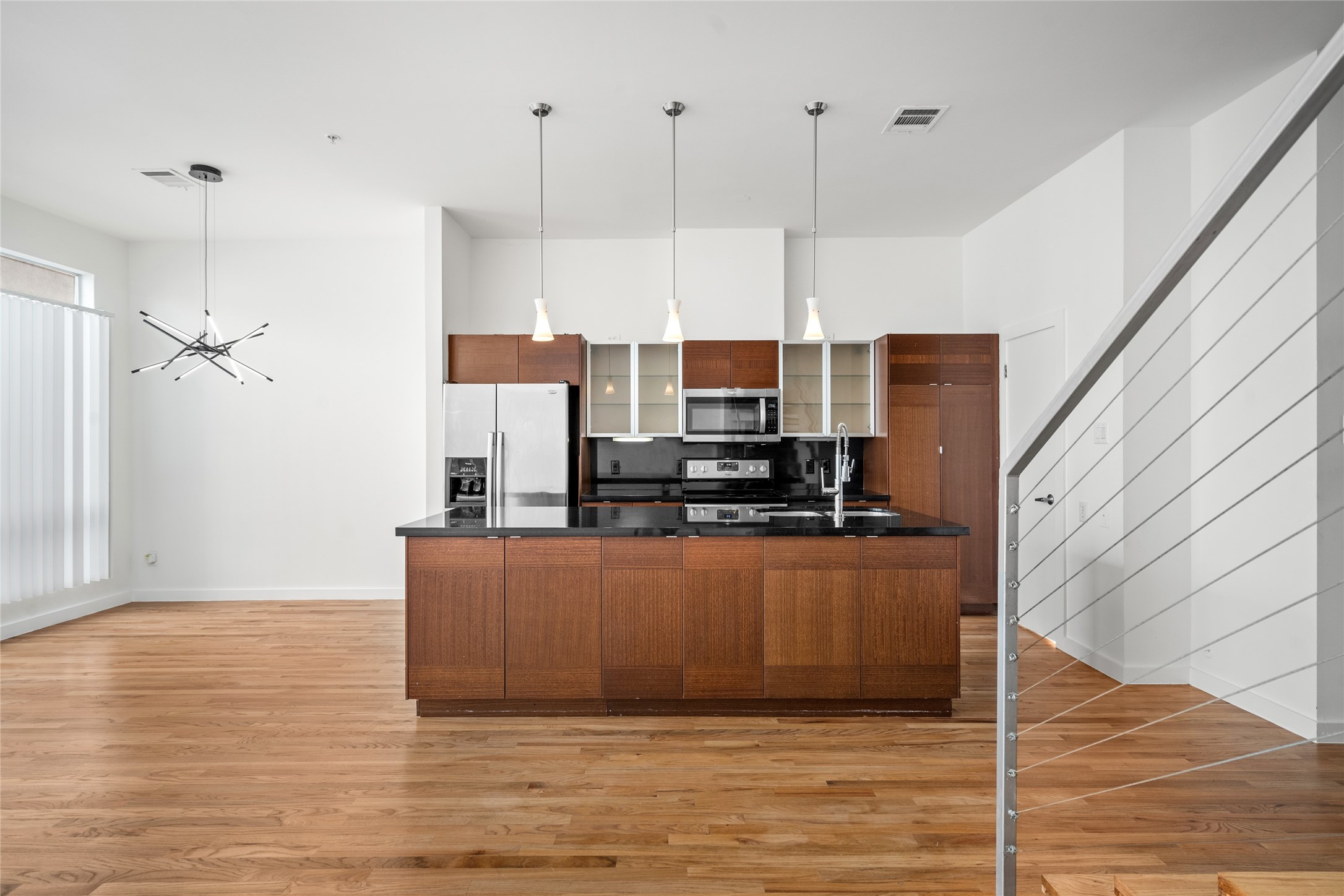 The open concept design keeps you engaged in every corner of the home, allowing you to stay connected to the kitchen, dining, and living areas, perfect for a social and functional flow.