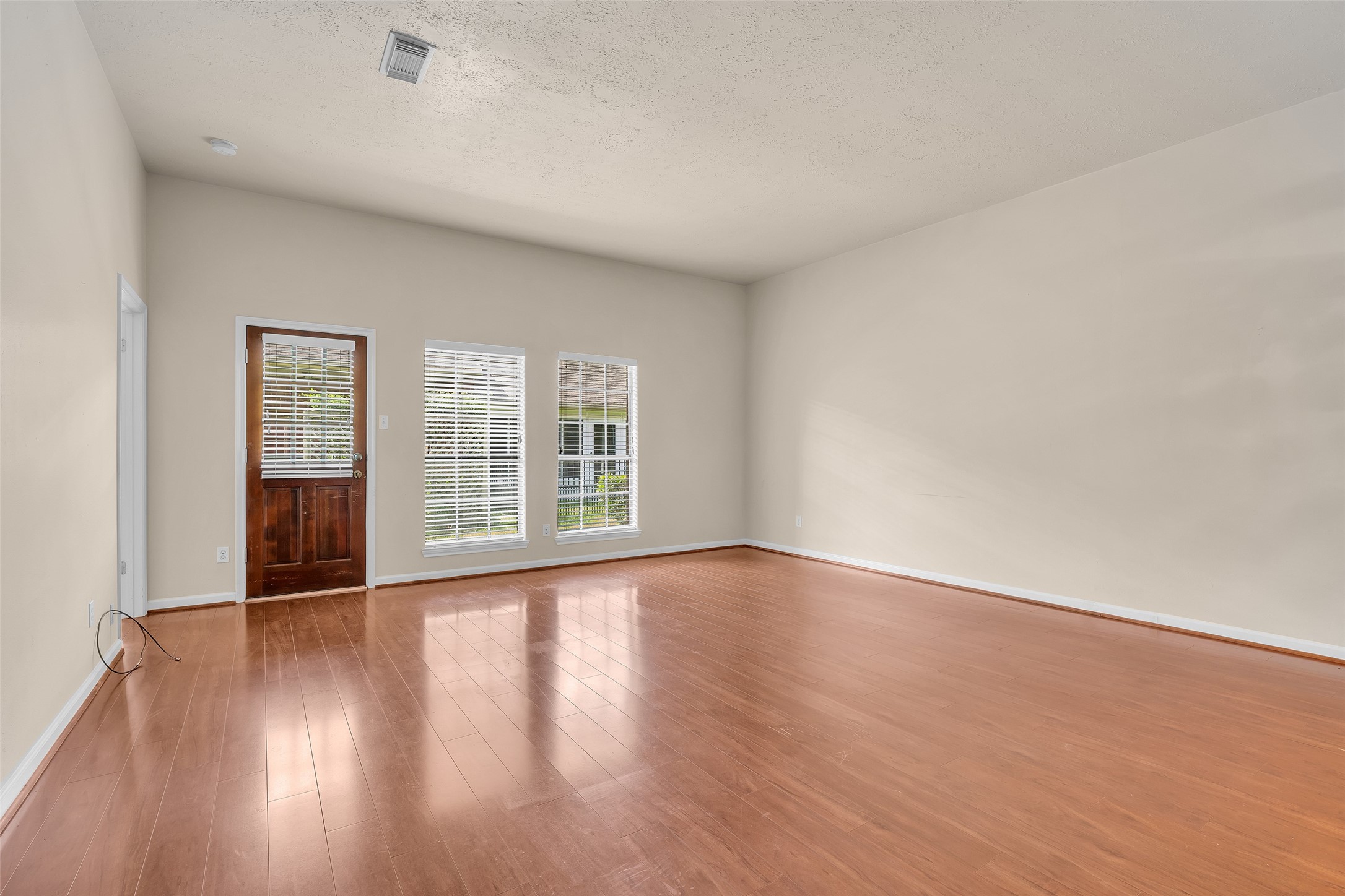A backdoor provides convenient access from the living room directly to the backyard.