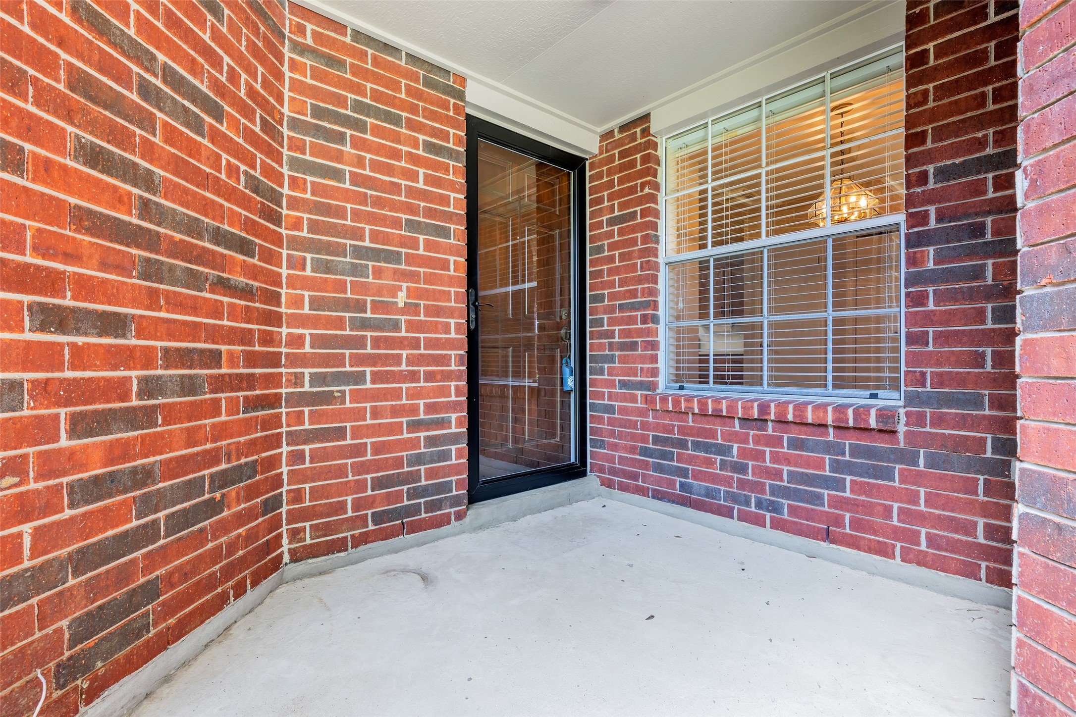 The entrance is framed by classic red brick walls, adding a timeless and welcoming touch to the exterior. The entrance is framed by classic red brick walls, adding a timeless and welcoming touch to the exterior.