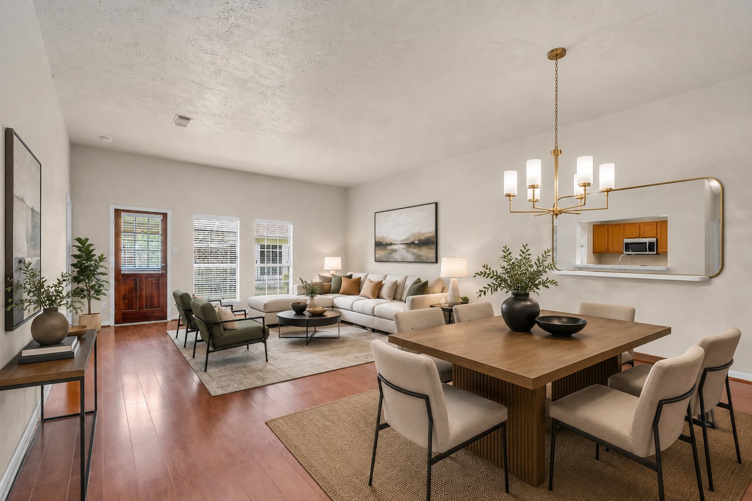The living room and dining area receive plenty of natural light through windows overlooking the backyard, creating a bright and airy feel throughout the space. The living room and dining area receive plenty of natural light through windows overlooking the backyard, creating a bright and airy feel throughout the space.