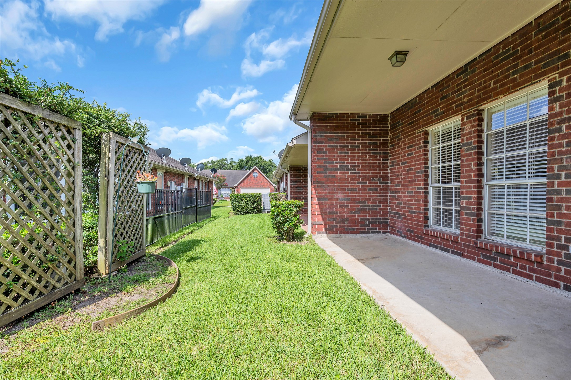 The property also includes a covered back patio and a low-maintenance backyard, offering a private and manageable outdoor space.