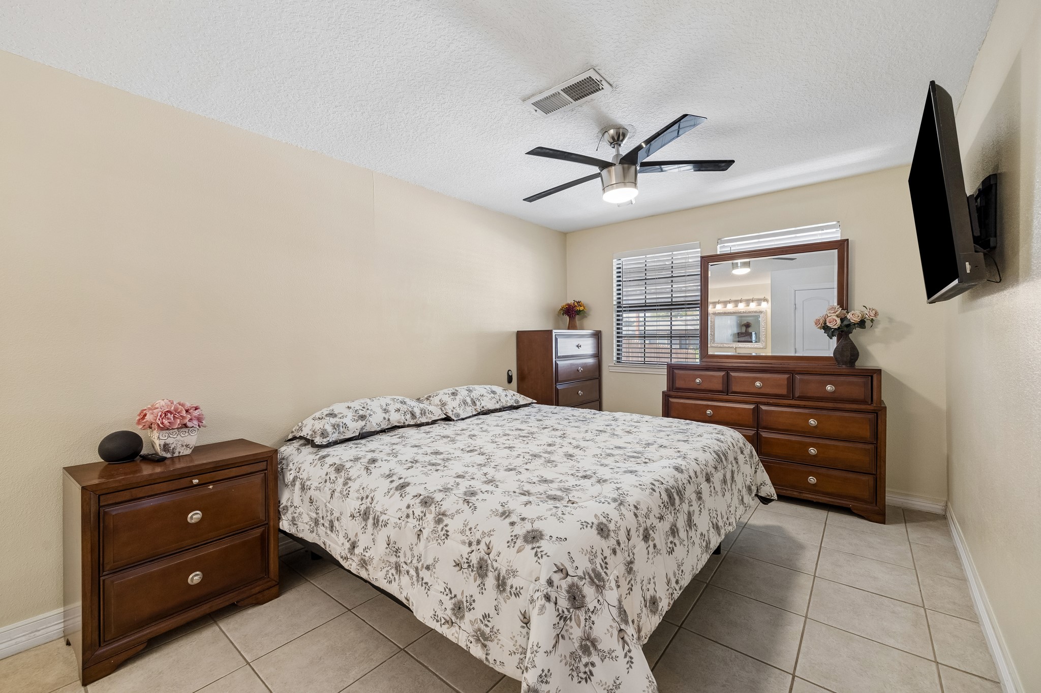 Large primary with tile throughout, creating a warm and inviting atmosphere.