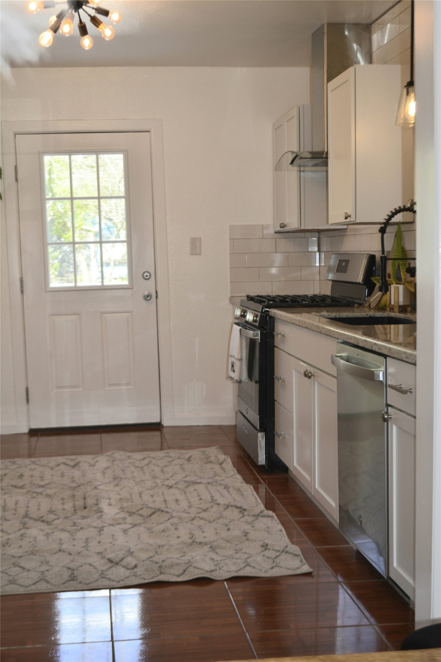 Kitchen with door leading to back porch