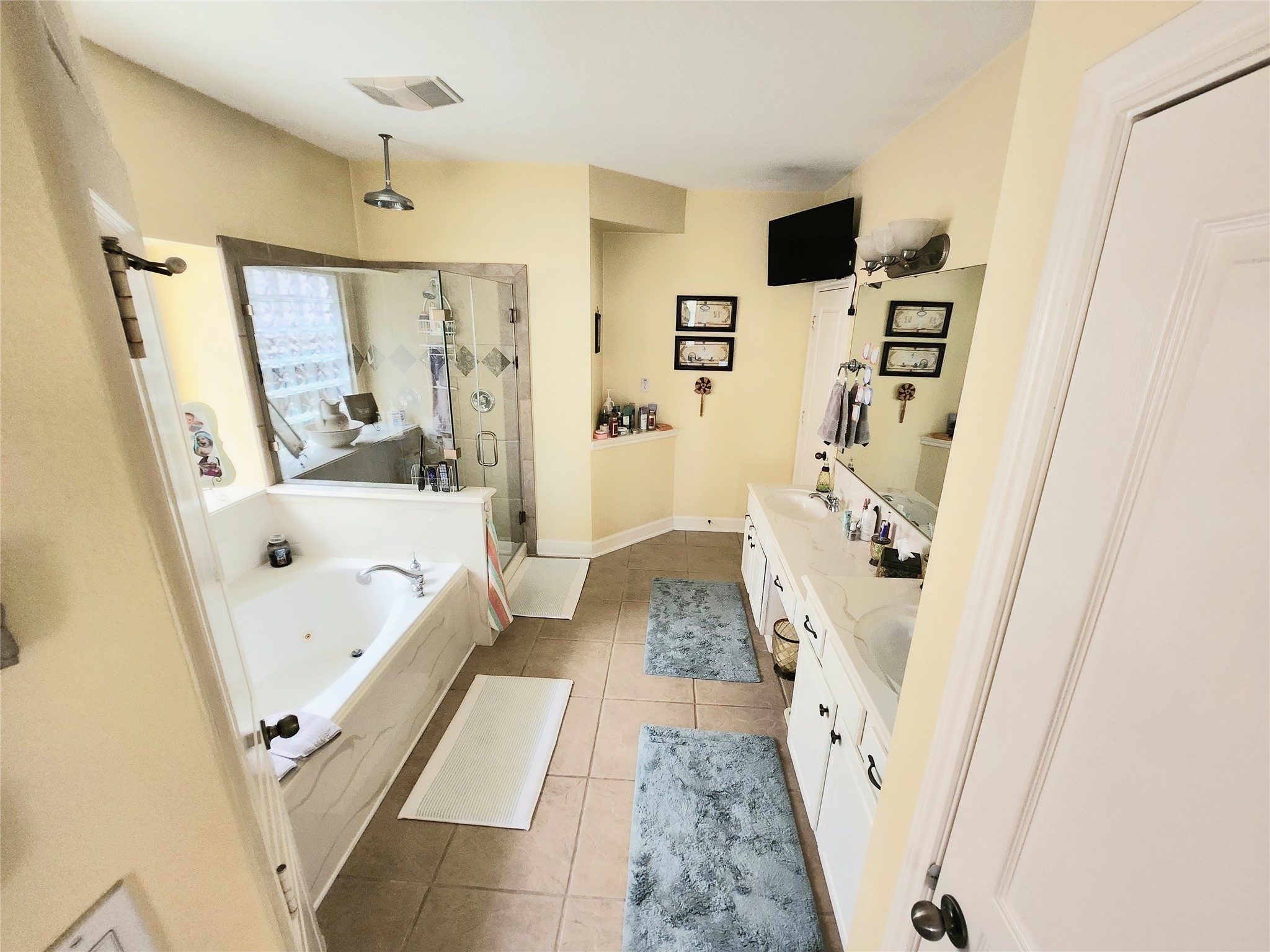 Luxurious and inviting primary bathroom