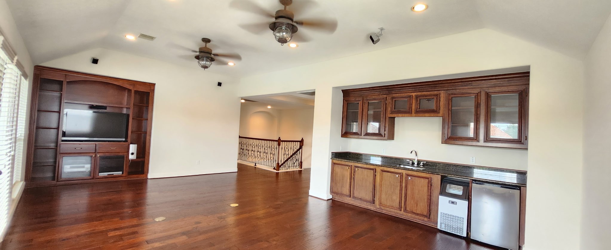 Along one side of the game room: sink, mini fridge, and many possibilities