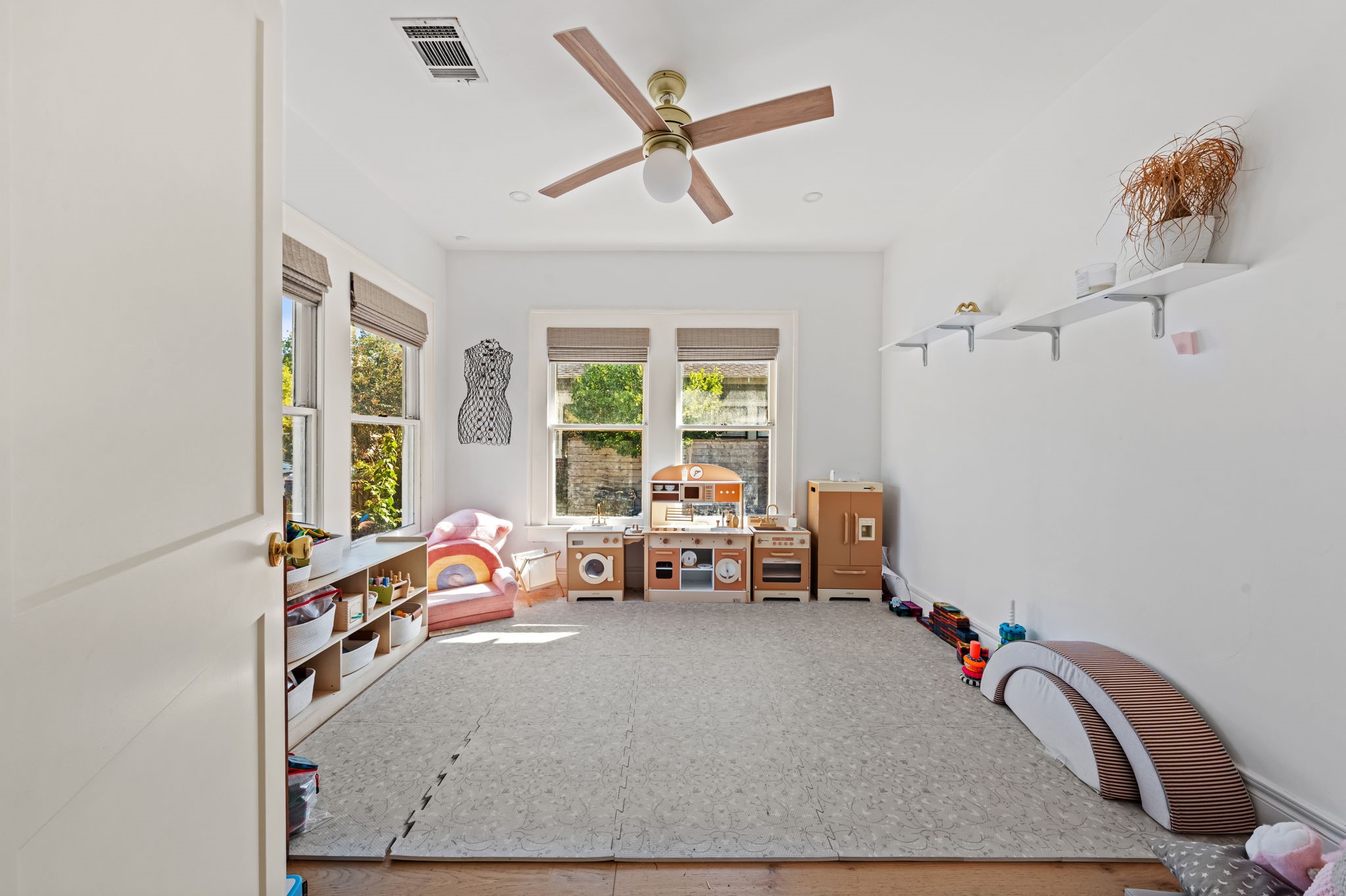 Front room with tons of natural light. Can be used as a playroom or a home office. Front room with tons of natural light. Can be used as a playroom or a home office.