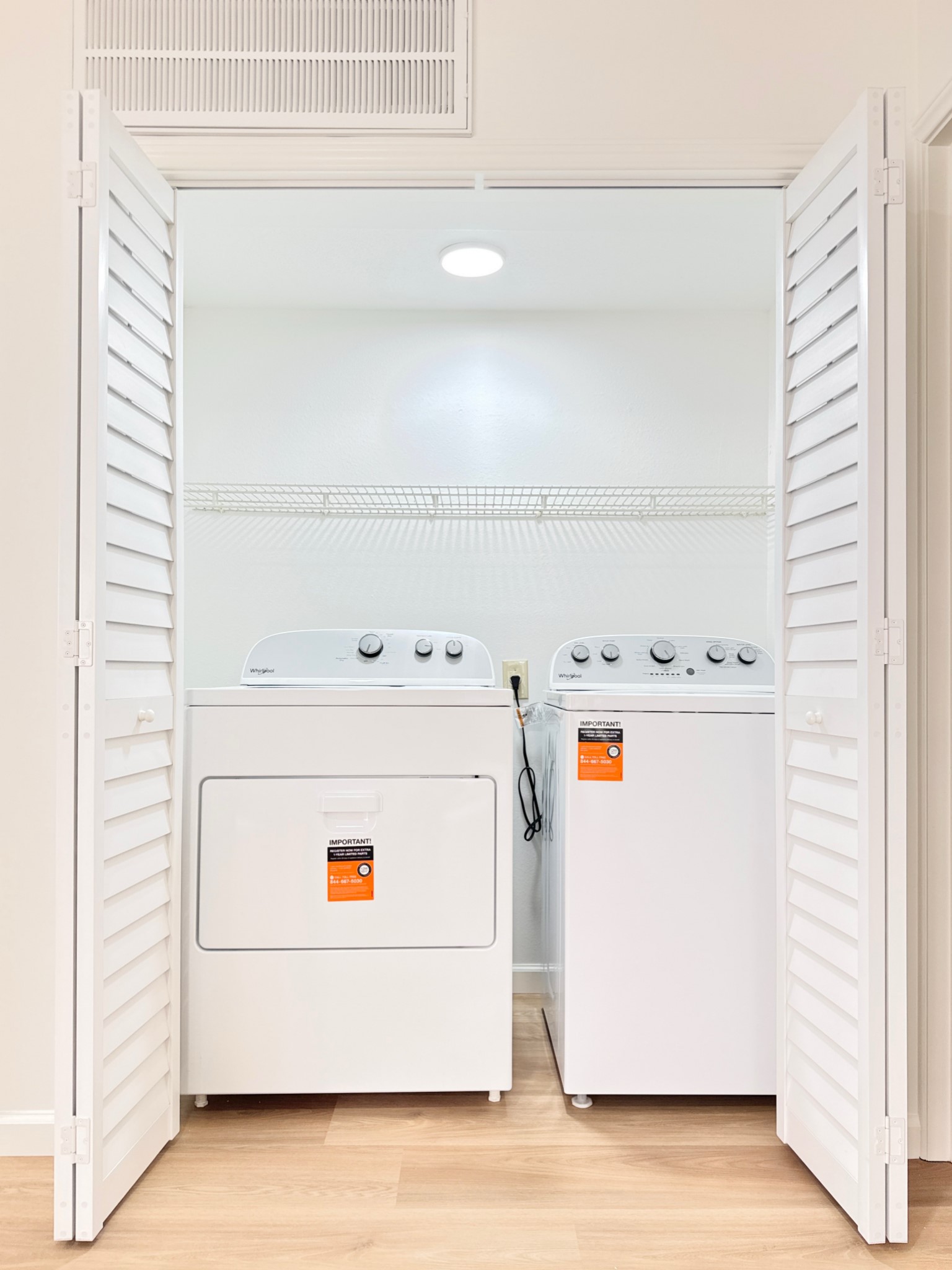 Enlarged laundry room with Brand New washer and dryer