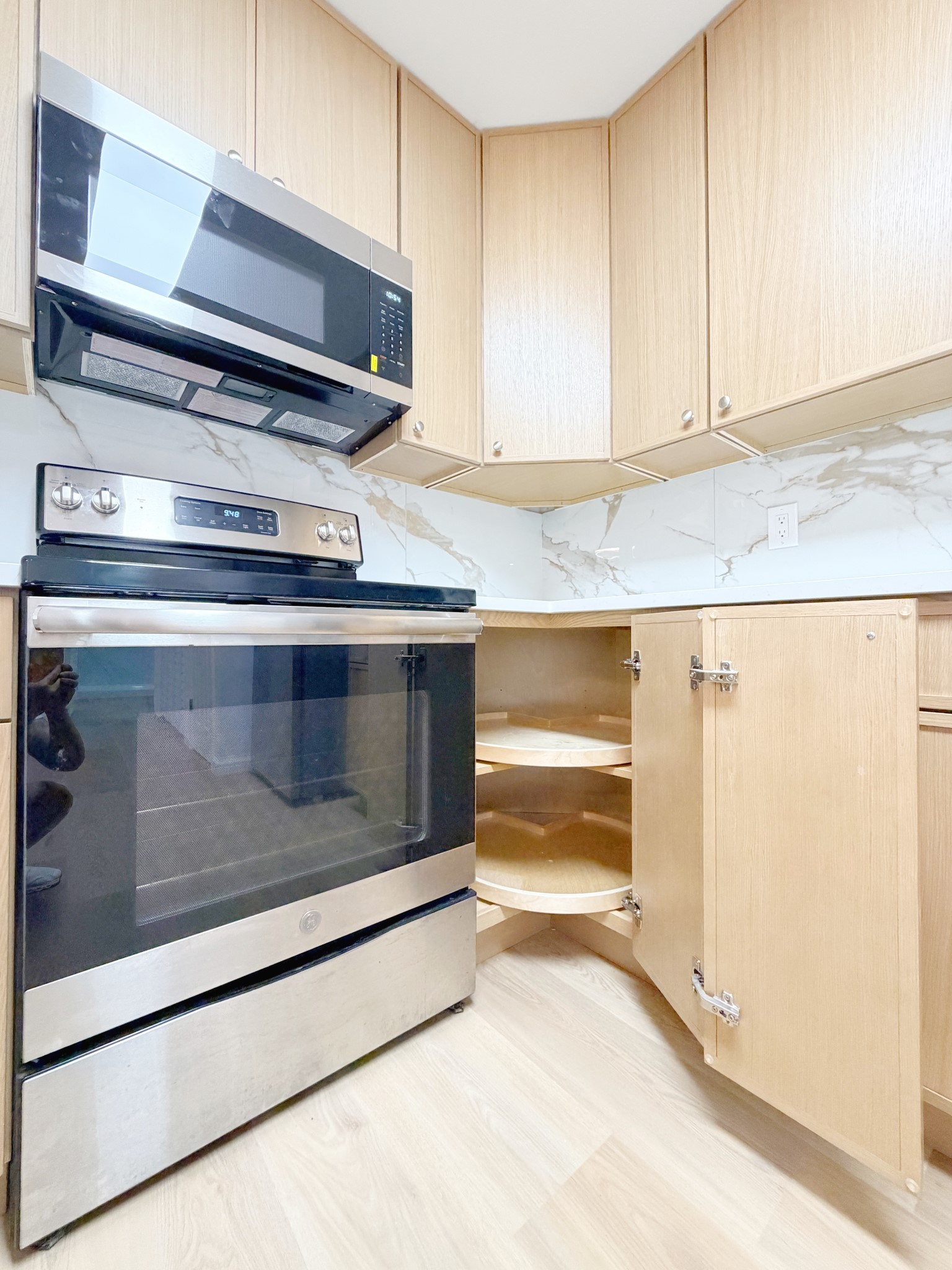 Corner cabinets include rotating trays for easy access to stored items.