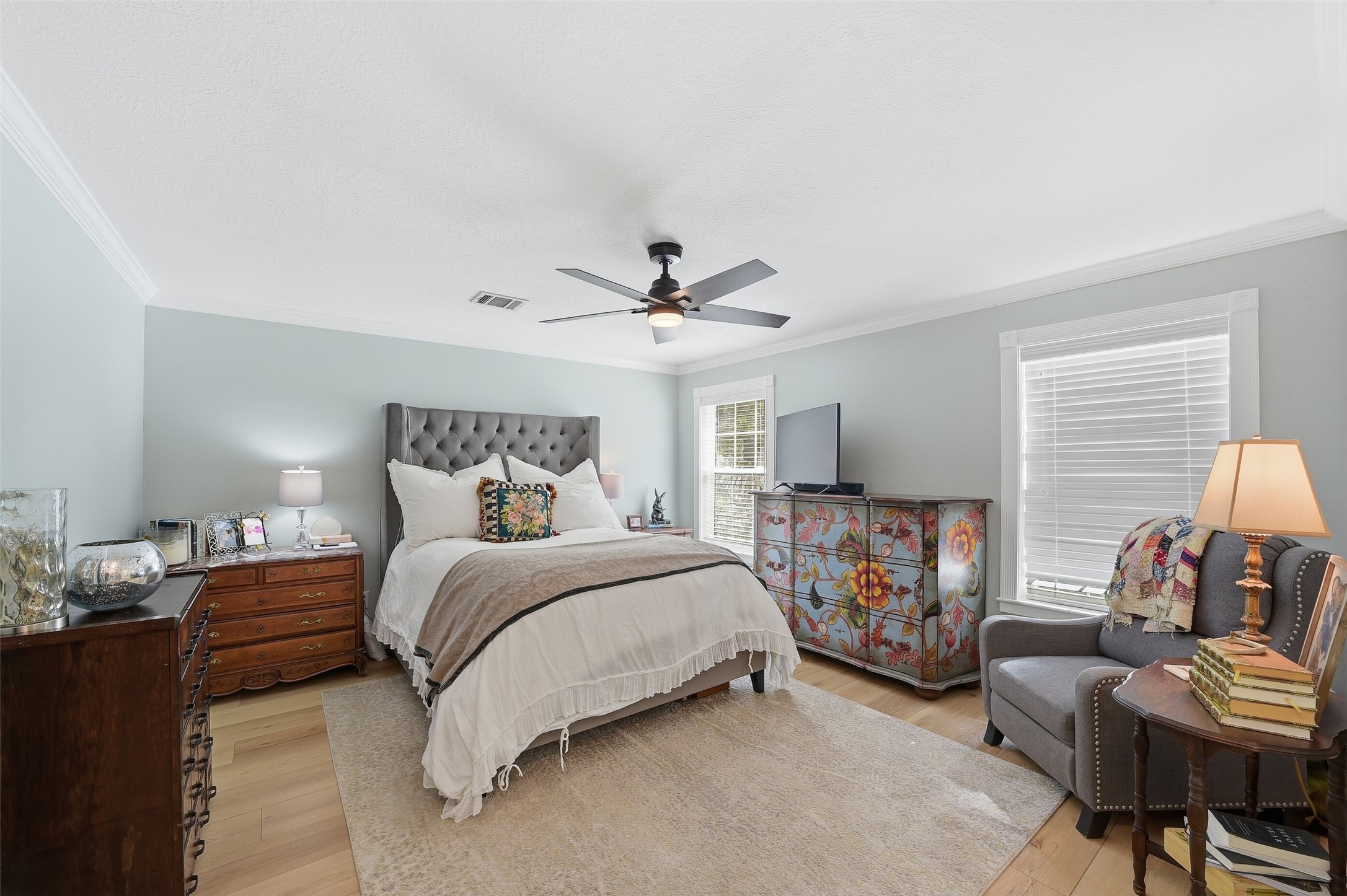 Primary bedroom, downstairs, warm and light.