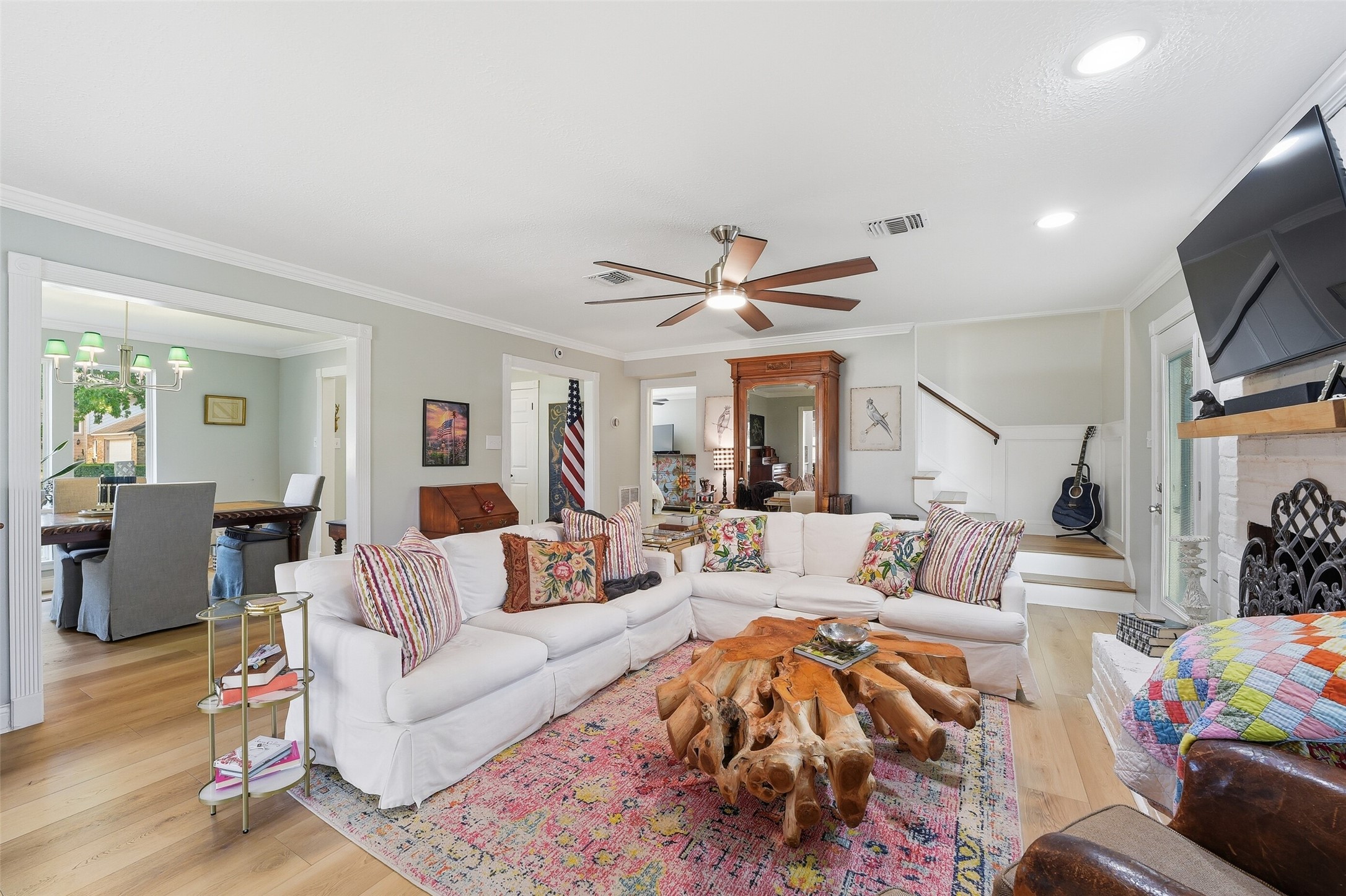 Large family room with gas log fireplace, and lots of natural light.