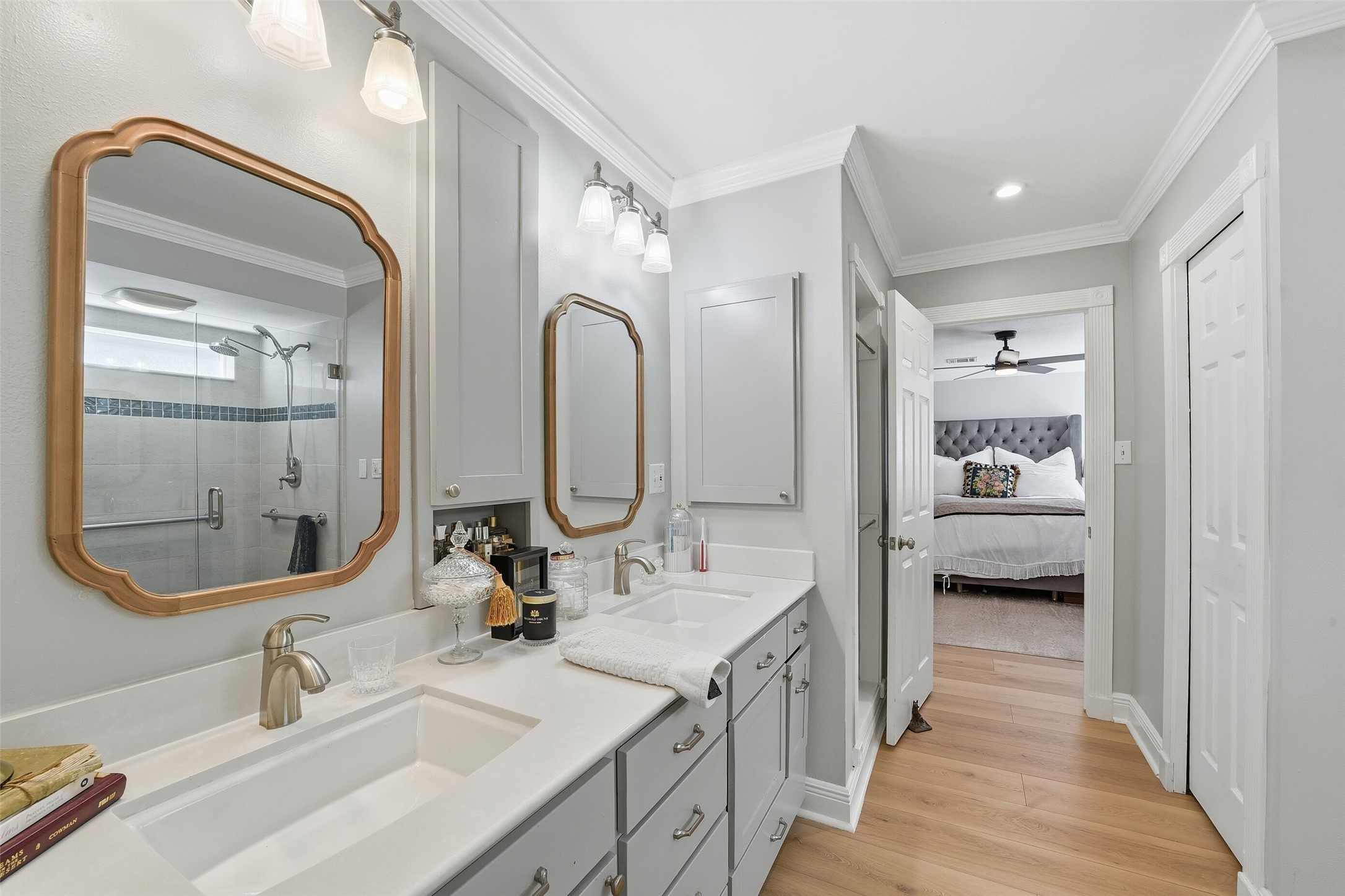 Ensuite bath with his and hers vanities and closets.