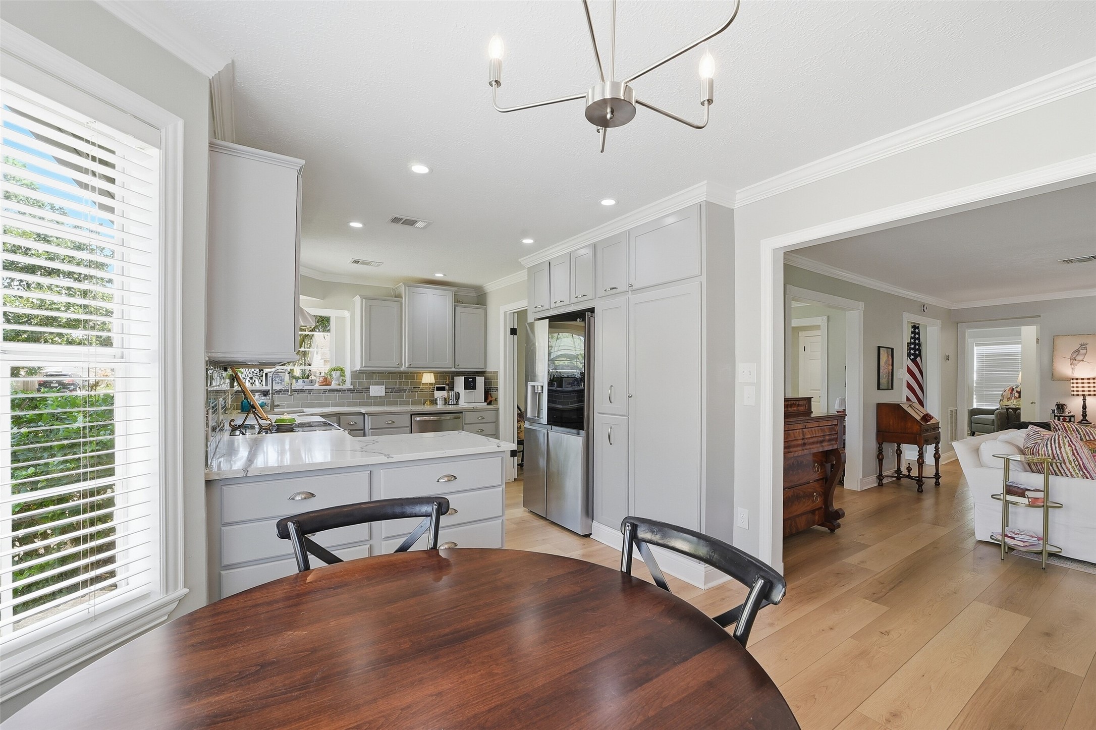 Kitchen is open enough to family room, but not so open that guests would see dishes in the sink.