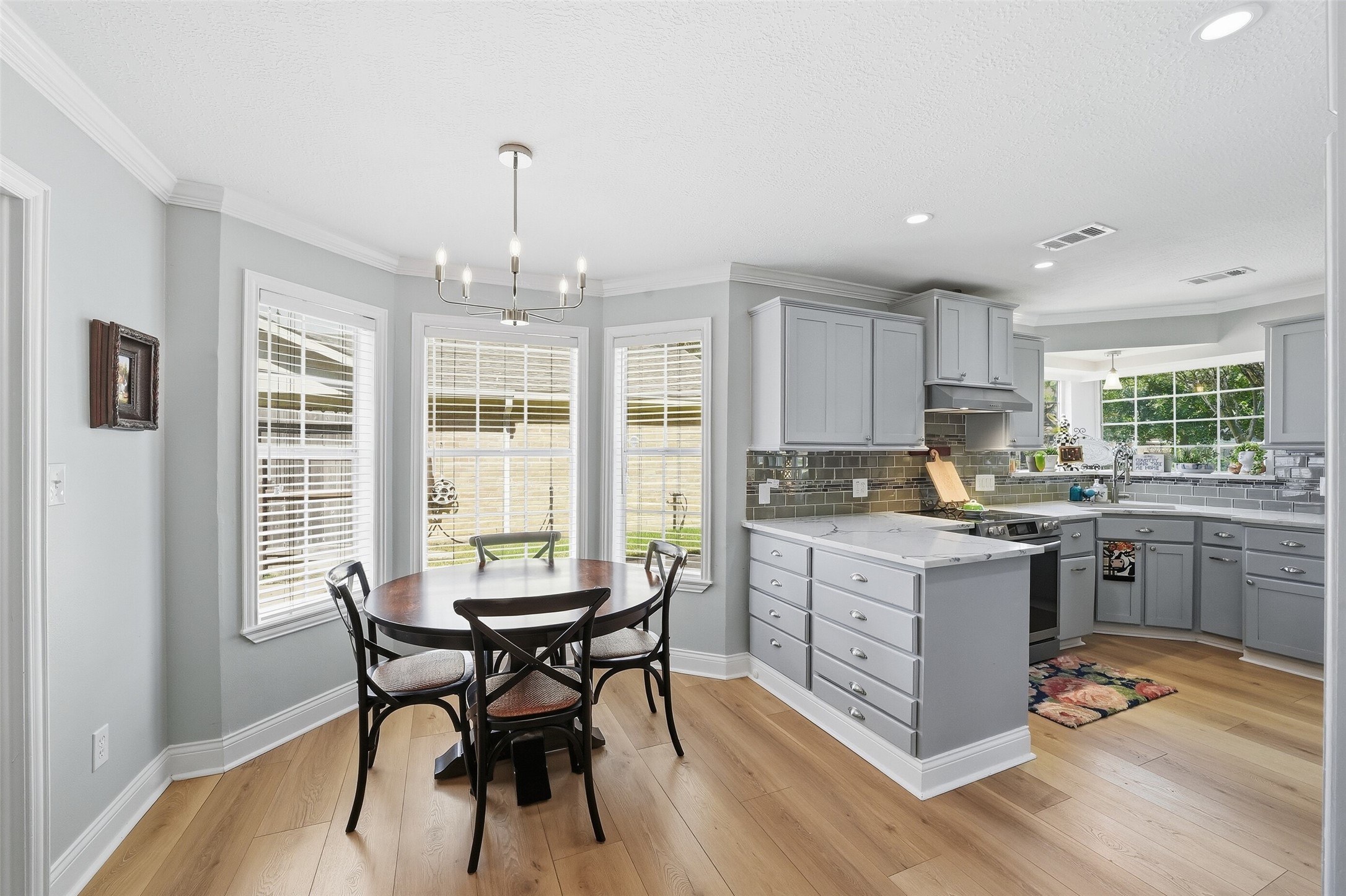 These warm honey colored wood like floors add to the over all coziness of this home.