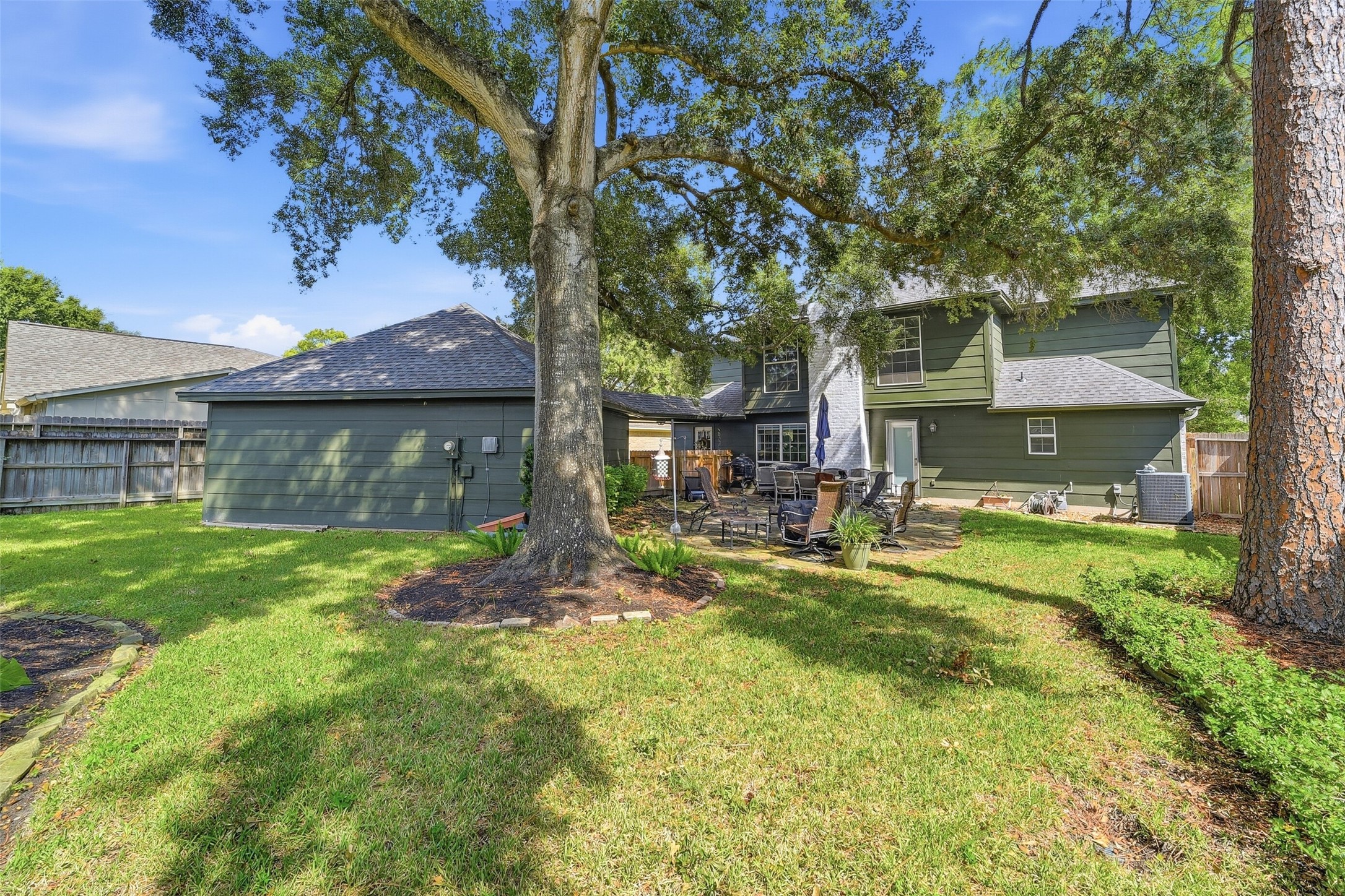 Big gorgeous backyard with patio and lots of shade.