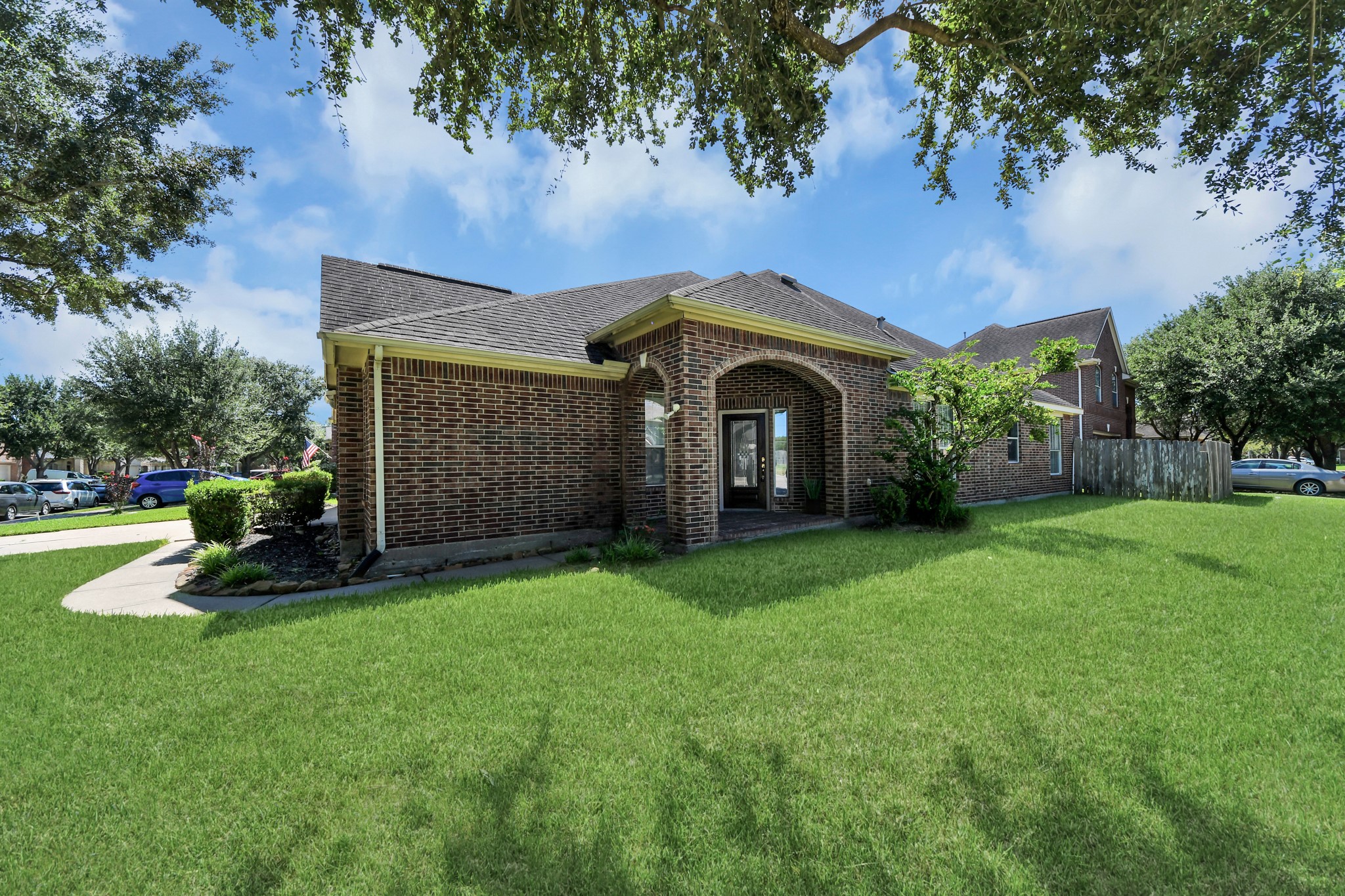 Charming brick home with a spacious front yard, mature trees, and a two-car garage, offering a warm and inviting curb appeal. Charming brick home with a spacious front yard, mature trees, and a two-car garage, offering a warm and inviting curb appeal.