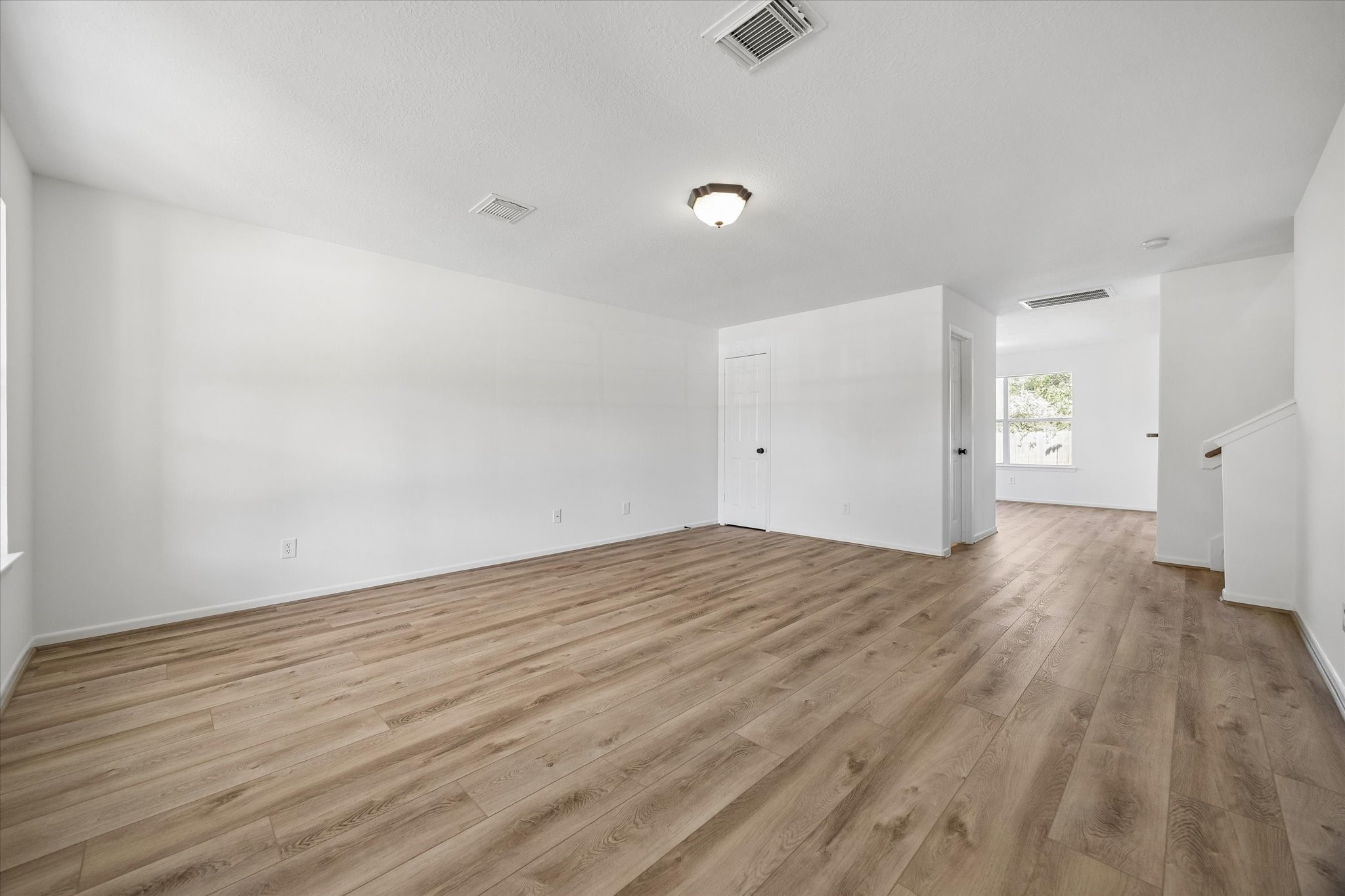 This beautifully updated, spacious living room offers the perfect setting for gathering with family and friends. Large windows fill the space with natural light, creating a bright, warm, and inviting atmosphere. With plenty of room to relax, entertain, and enjoy each other's company, this welcoming space is truly the heart of the home, where everyday moments turn into lasting memories. This beautifully updated, spacious living room offers the perfect setting for gathering with family and friends. Large windows fill the space with natural light, creating a bright, warm, and inviting atmosphere. With plenty of room to relax, entertain, and enjoy each other's company, this welcoming space is truly the heart of the home, where everyday moments turn into lasting memories.