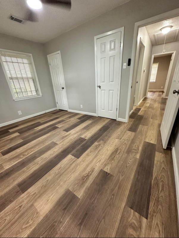 Master Bedroom - with master closet and large windows over looking backyard