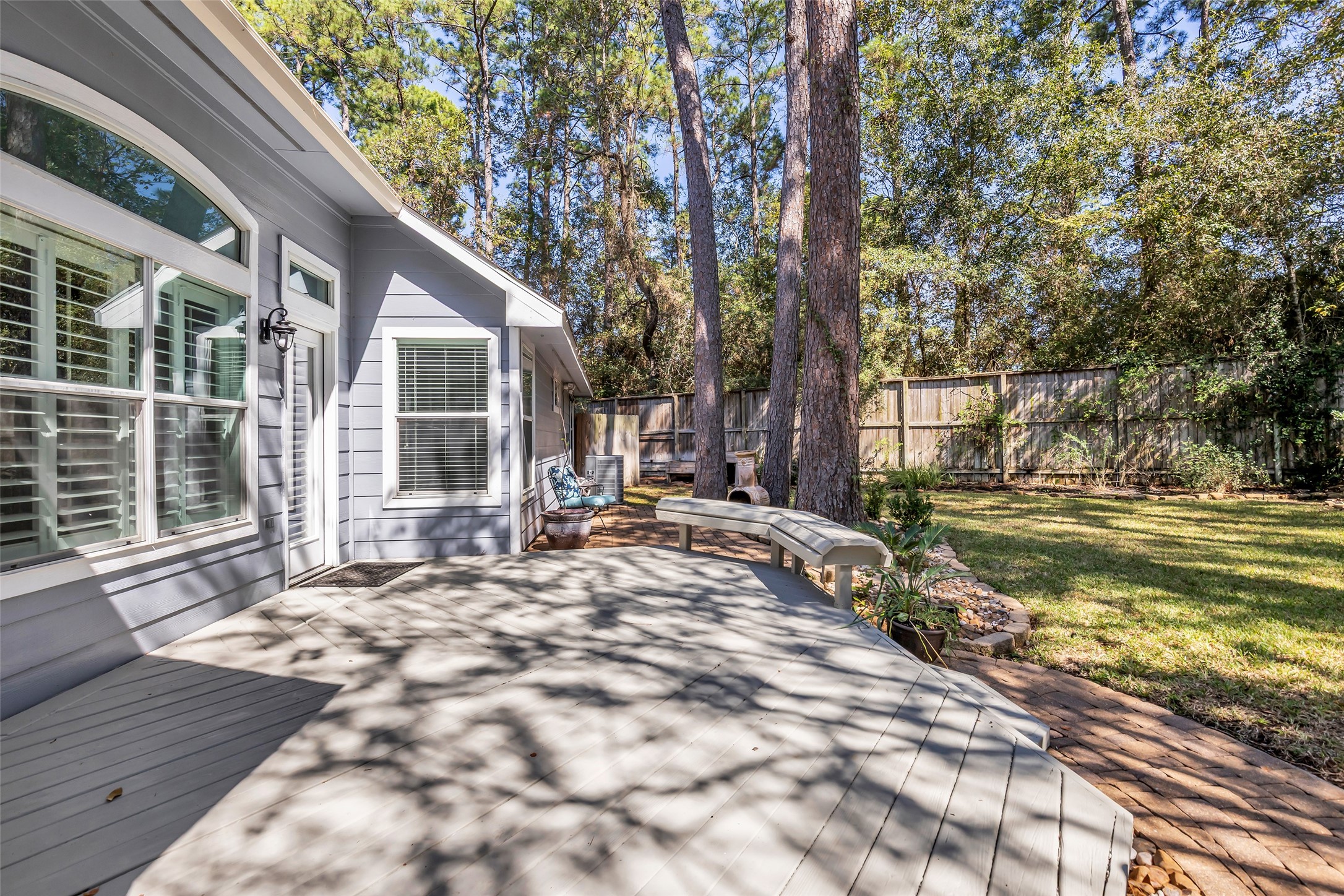 Large Deck and Fenced Backyard with Greenspace behind