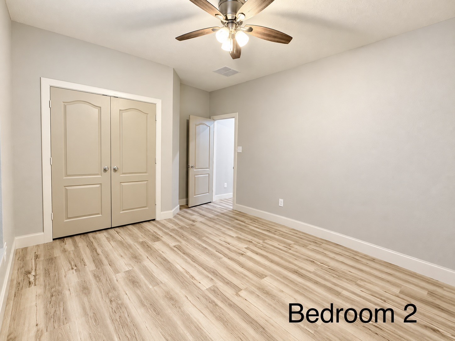 Located at the front of the home, the second bedroom offers generous space, a spacious closet, and plenty of room for comfortable living and storage.