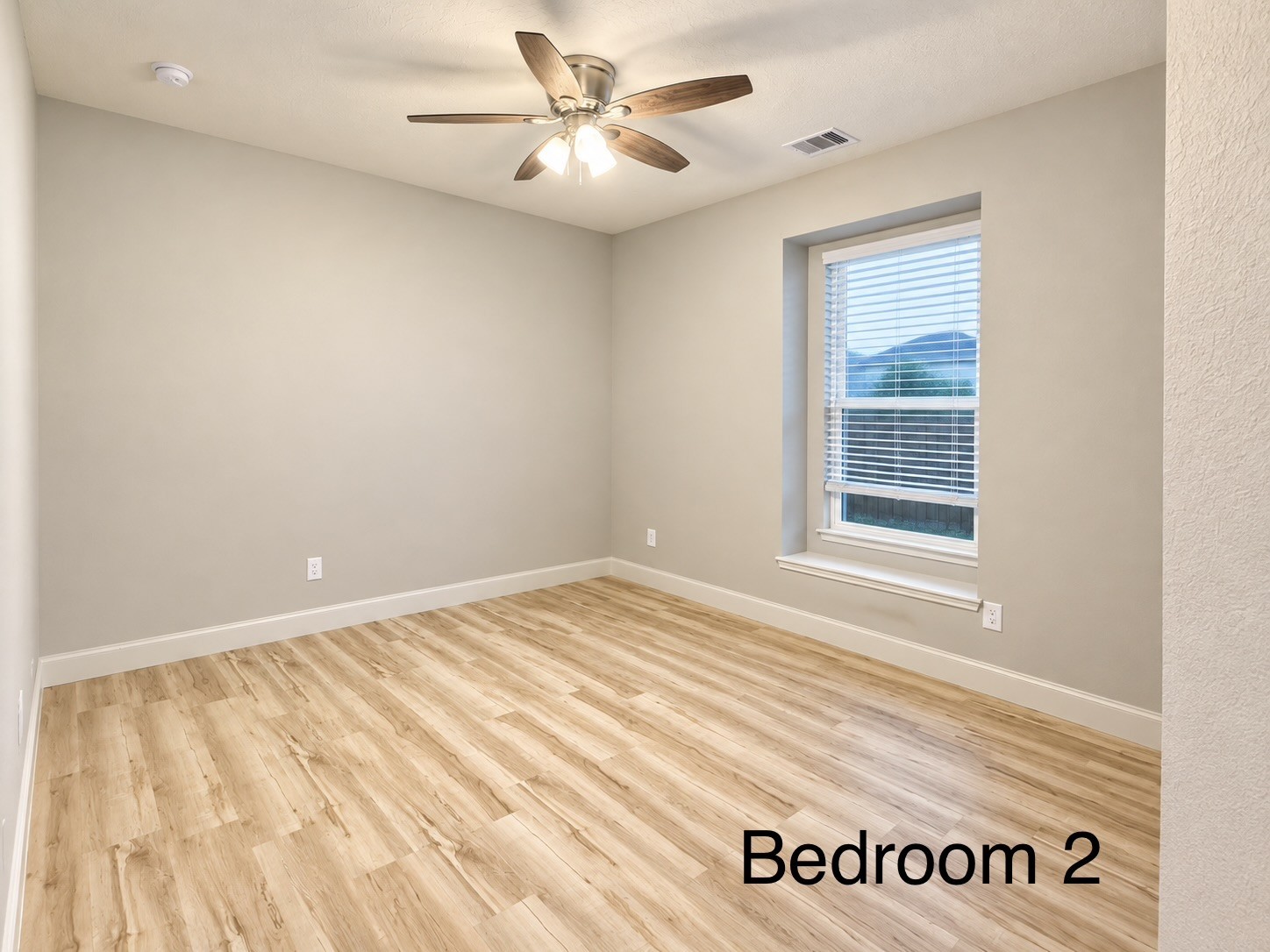 The second bedroom is conveniently located at the front of the home and offers a spacious layout with plenty of room to relax and personalize.