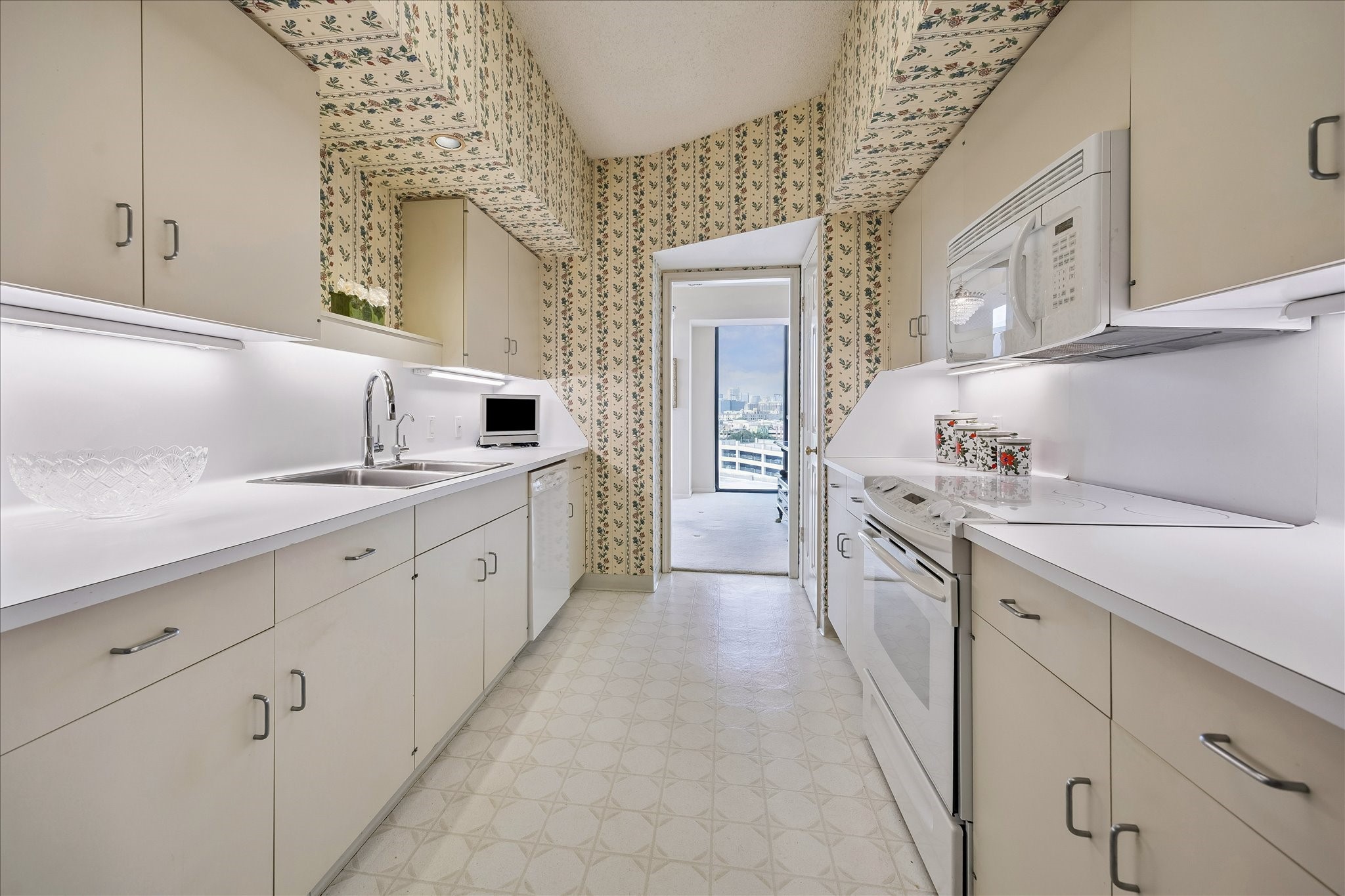 Kitchen leading to the breakfast room. Kitchen leading to the breakfast room.