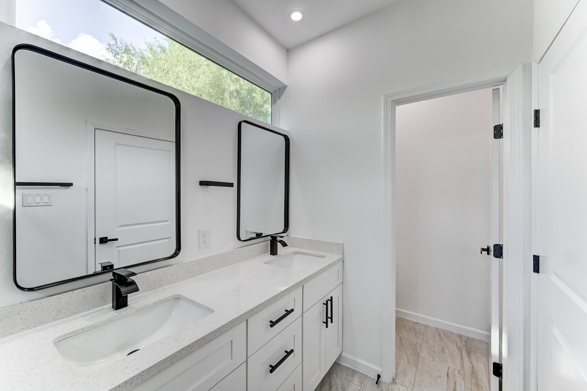 Primary bathroom with dual vanities