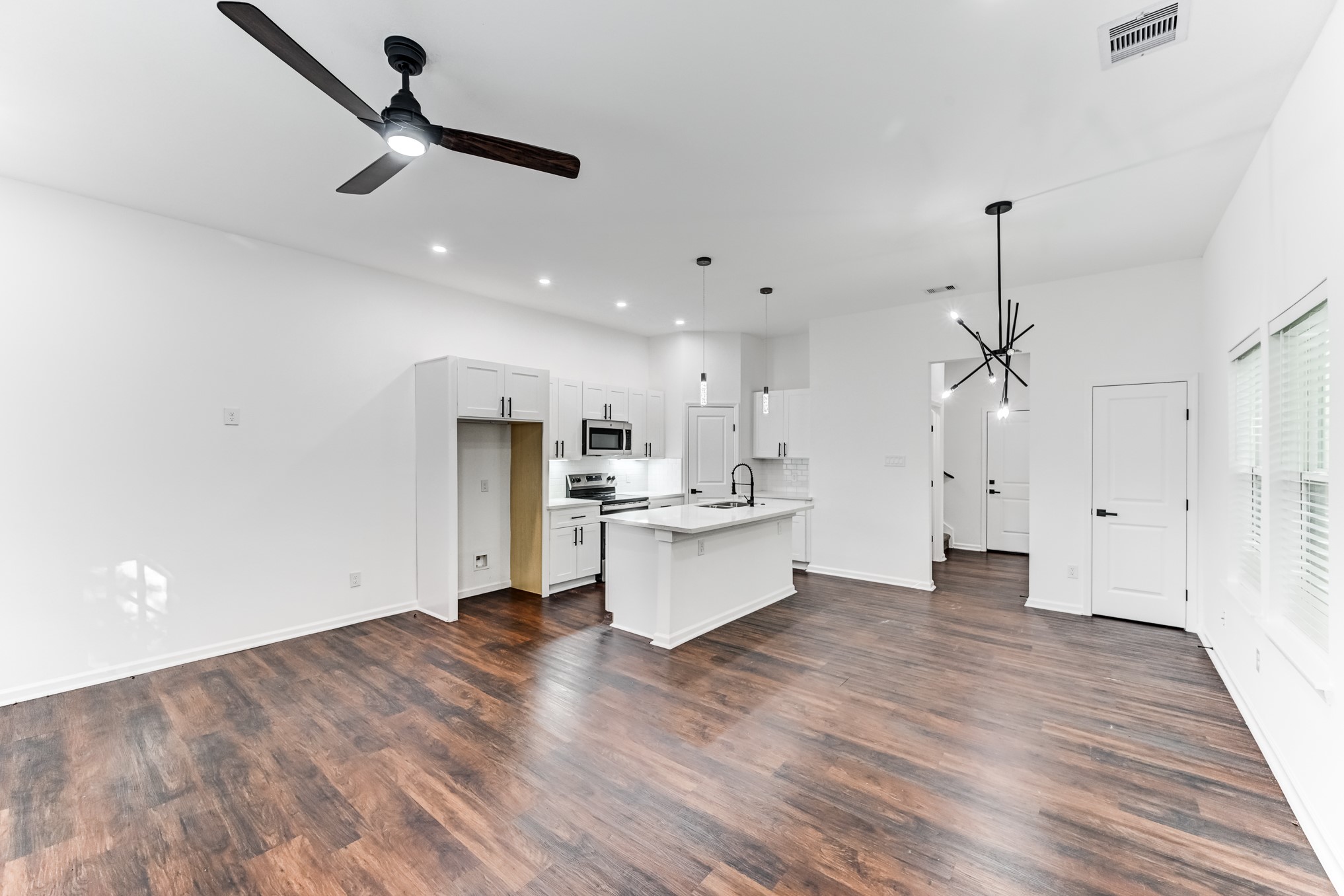 Open living space with wood flooring