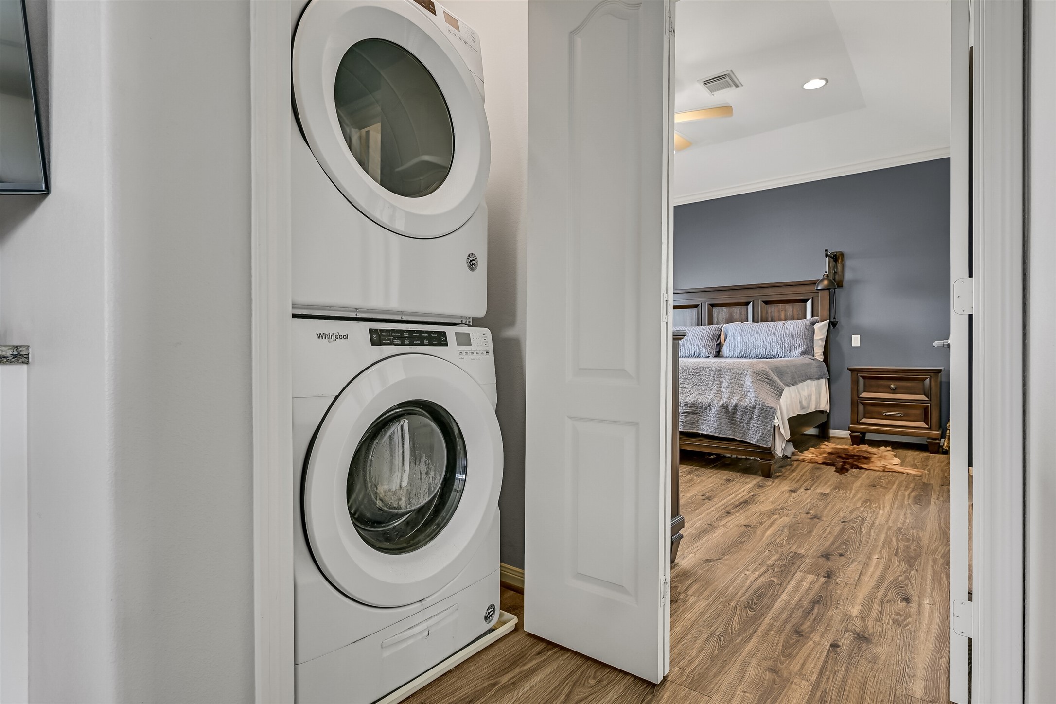 Before progressing to the bedrooms, we come to the stacking full-size washer/dryer area. Conveniently located within steps of the primary bedroom, as well as secondary bedrooms.