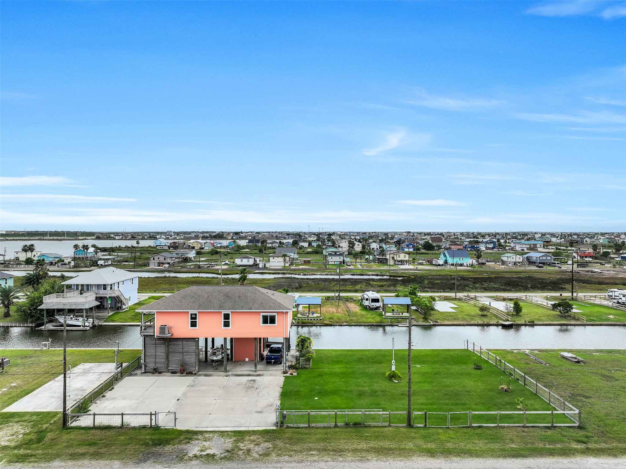 This well-loved home is situated on three, yes THREE lots! Notice the abundance of parking under and around the home. Perfect for your boat/trailer, car collection  - your choice. RV hookups are found on the extra lot.
