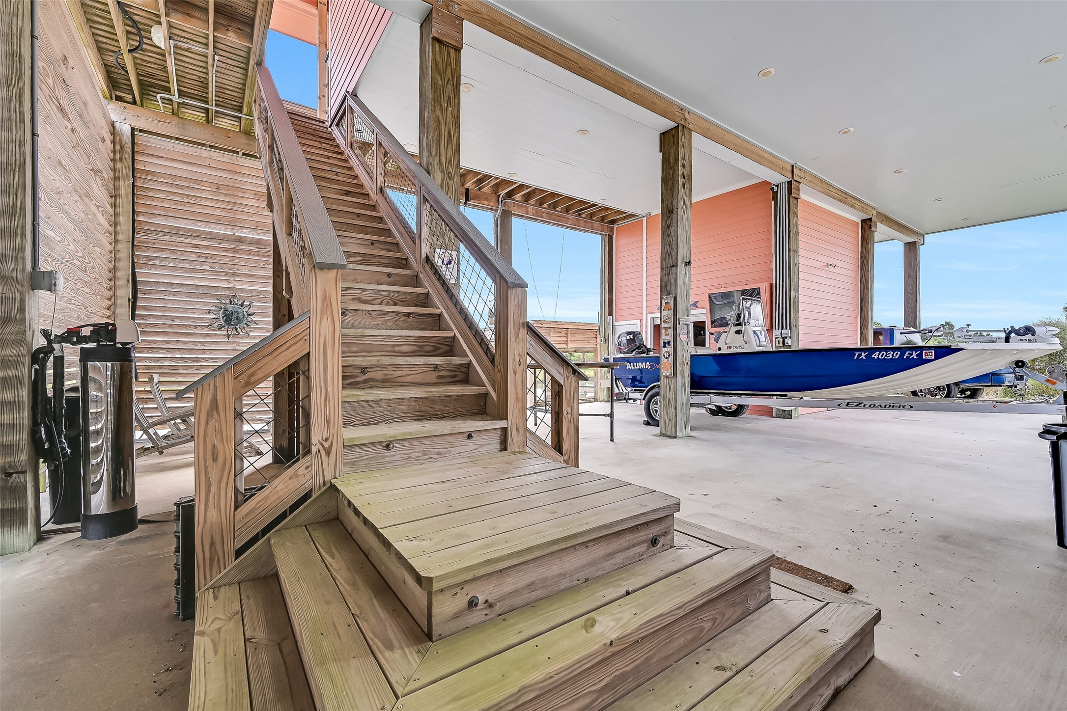 Notice the whole-house water softener to the left of the stairs.