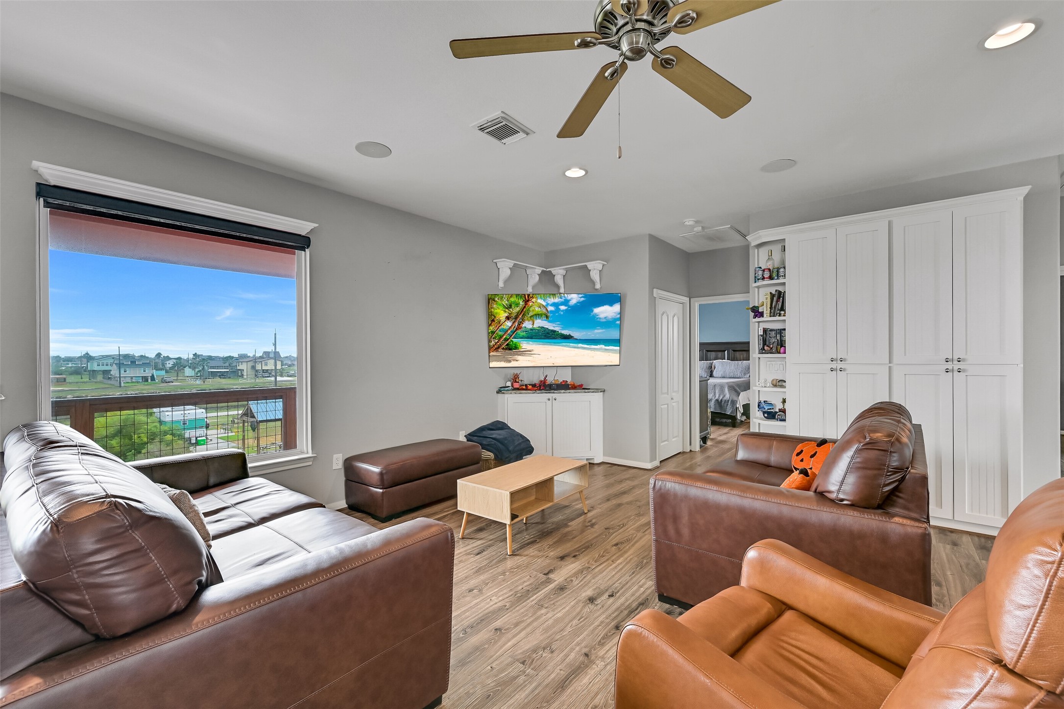 If you love a home with great storage, you better put this one on your short list! Notice the additional built-ins to the Right. Notice the recessed lighting. Premium roll shades are found on each window.