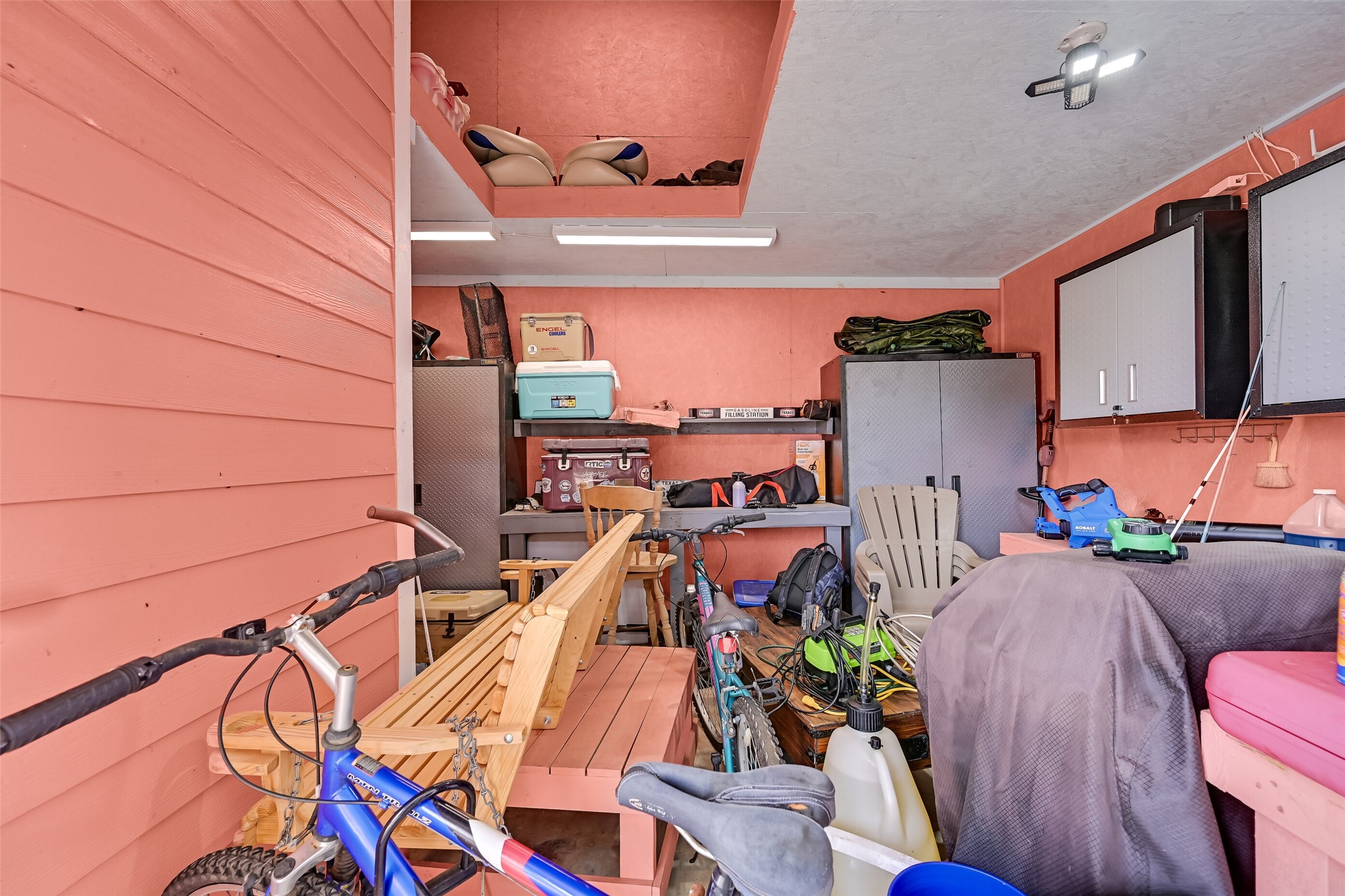 This storage room contains a work shop and additional lofted area serving as additional storage!