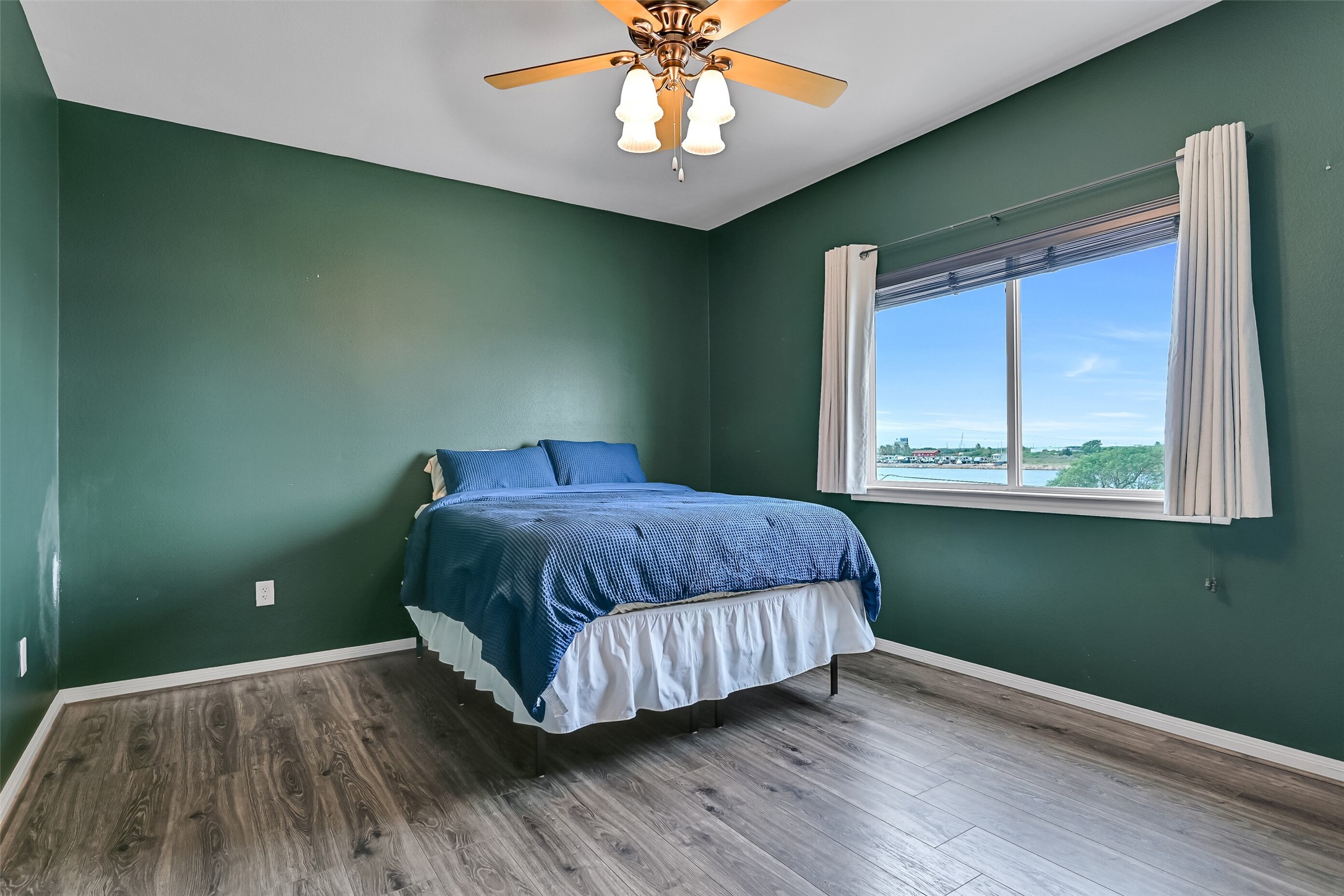 Secondary bedroom with views of Highland Bayou. Notice there is no carpet in any of the bedrooms.