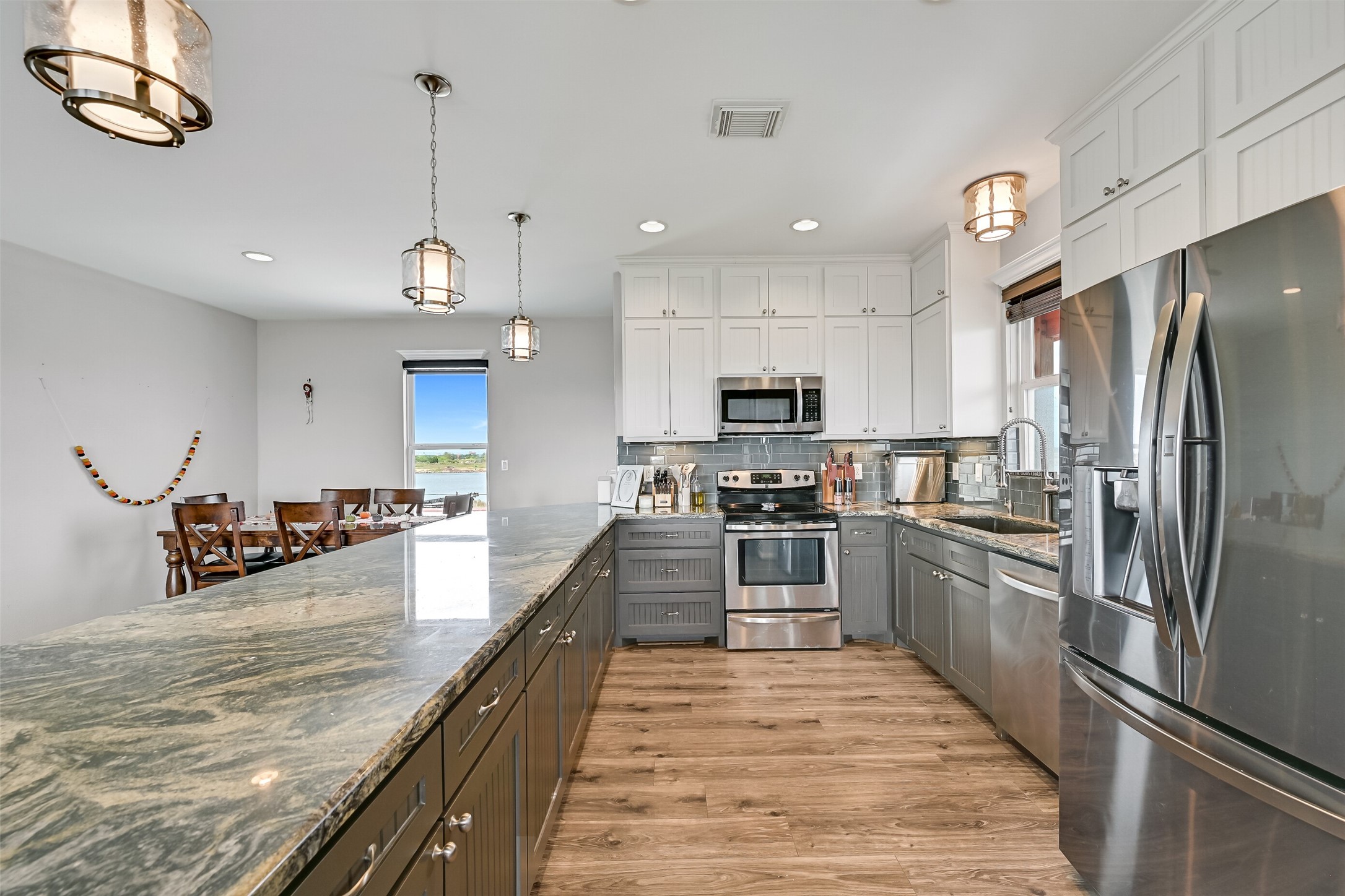Once again, storage is the theme of this home! ROWS upon ROWS of custom cabinetry greet you.