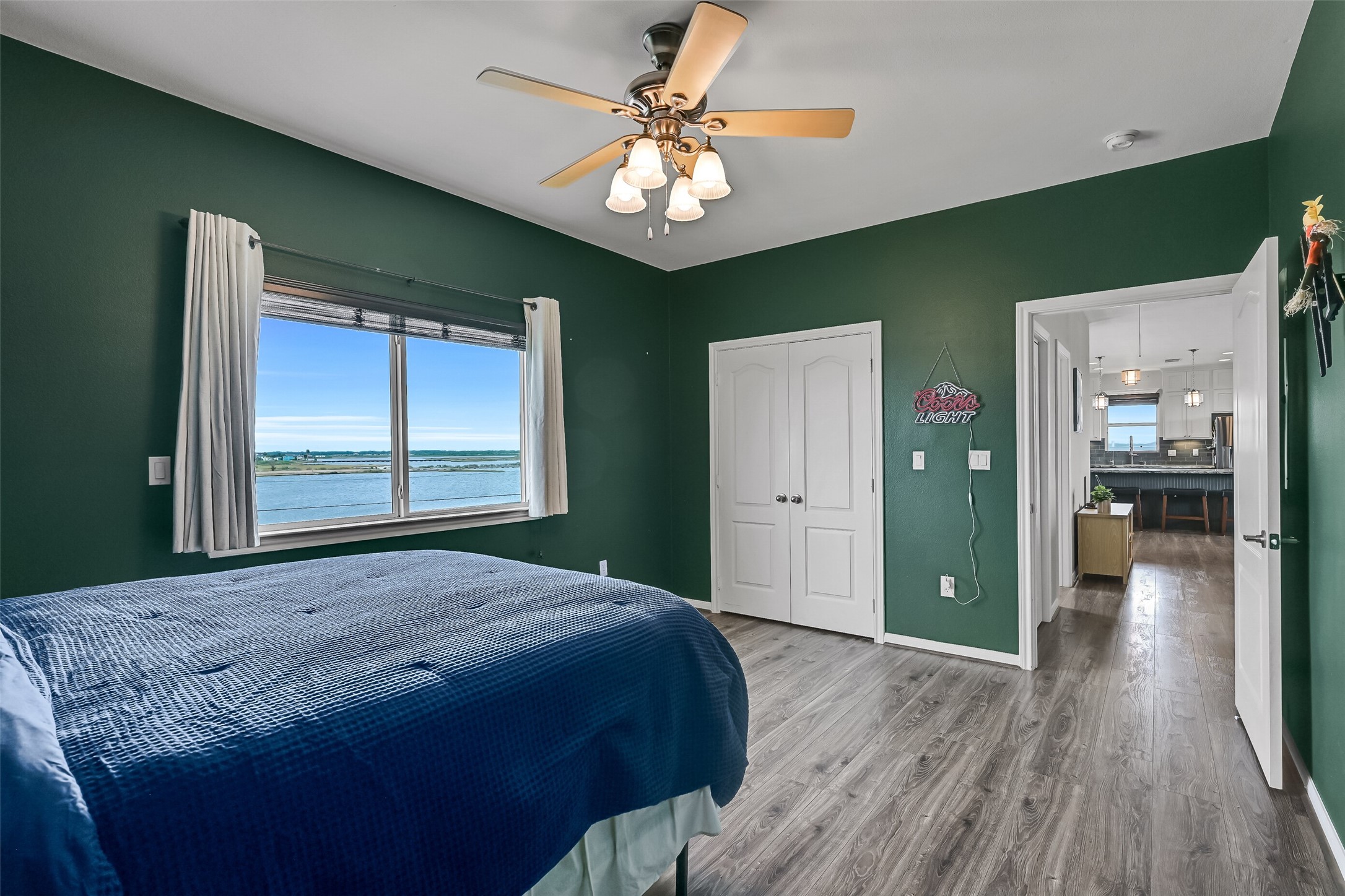 These views are what your guests will be able to wake up to! Double doors reveal a nice-sized closet. Notice the wall switch to the left of the window - which controls the electric storm shutter.