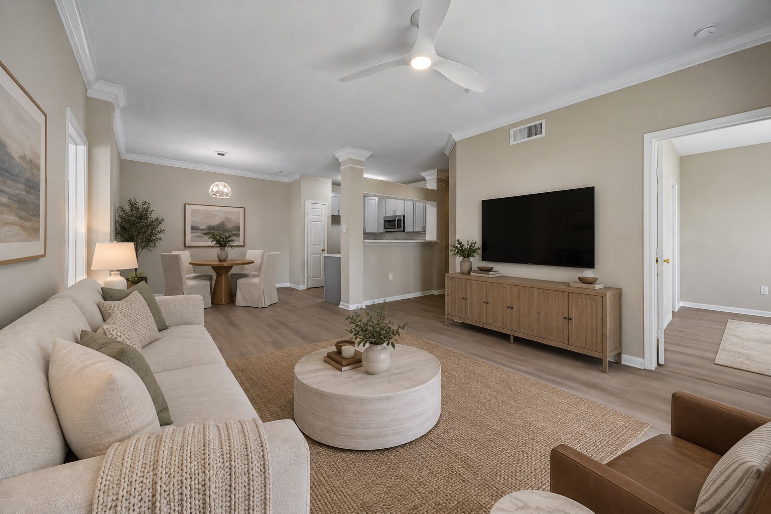 This unit was extensively updated in '26. Features a newer HVAC ('23), water heater ('23), freshly painted interior, double-pane windows, new floors. View of the wonderful living room highlighting the generous space for comfortable seating & furnishings. Open to the dining area & kitchen w/ convenient access to both bedrooms, creating an inviting layout for everyday living & entertaining. Photo is virtually stage. This unit was extensively updated in '26. Features a newer HVAC ('23), water heater ('23), freshly painted interior, double-pane windows, new floors. View of the wonderful living room highlighting the generous space for comfortable seating & furnishings. Open to the dining area & kitchen w/ convenient access to both bedrooms, creating an inviting layout for everyday living & entertaining. Photo is virtually stage.