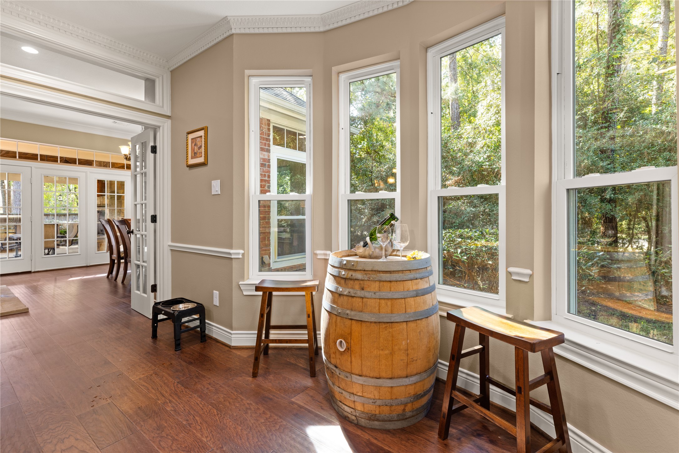 Lots of natural lighting overlooking wooded preserve