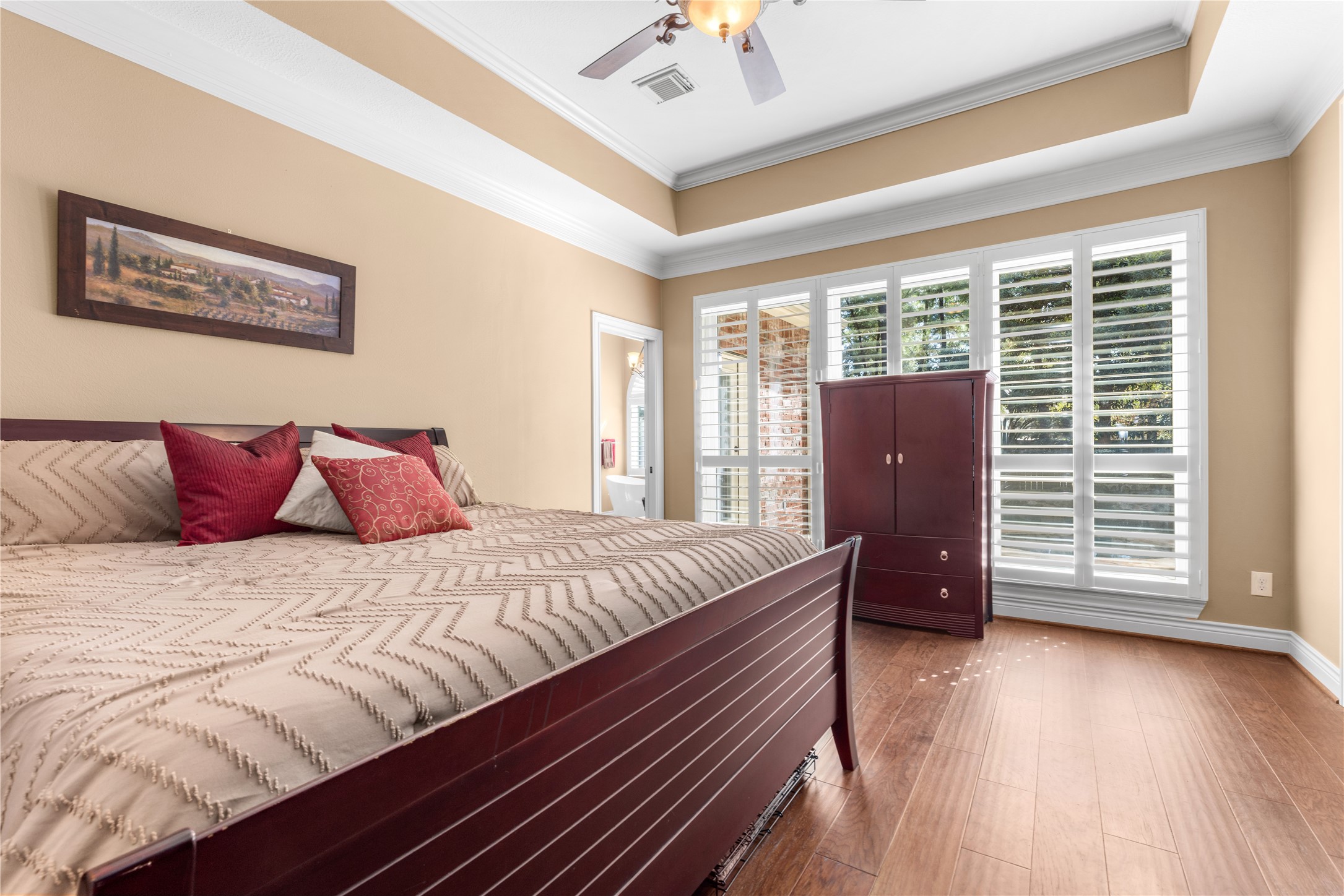Primary bedroom overlooking pool/spa