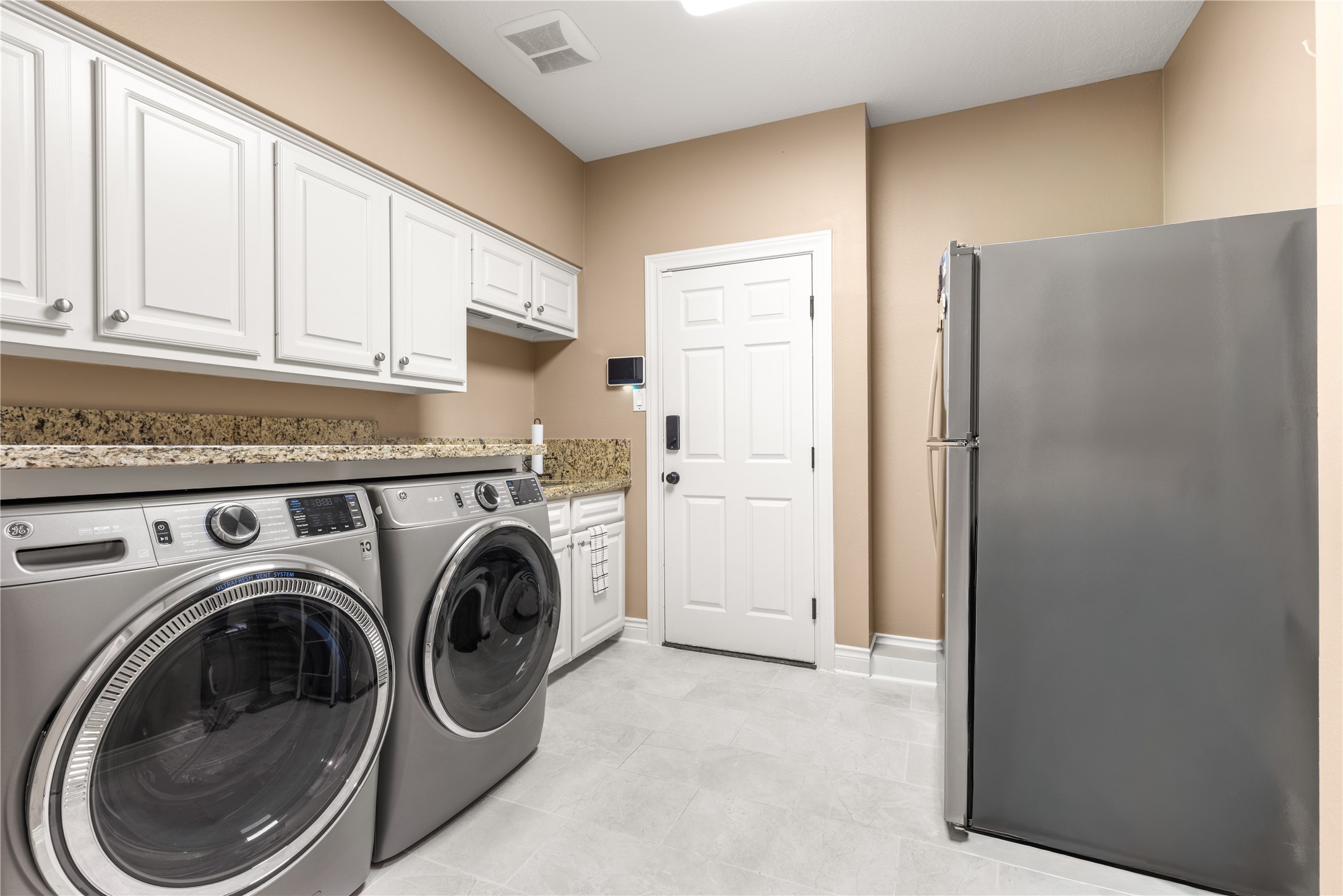 Utility room with sink and room for a refrigerator. 11x10