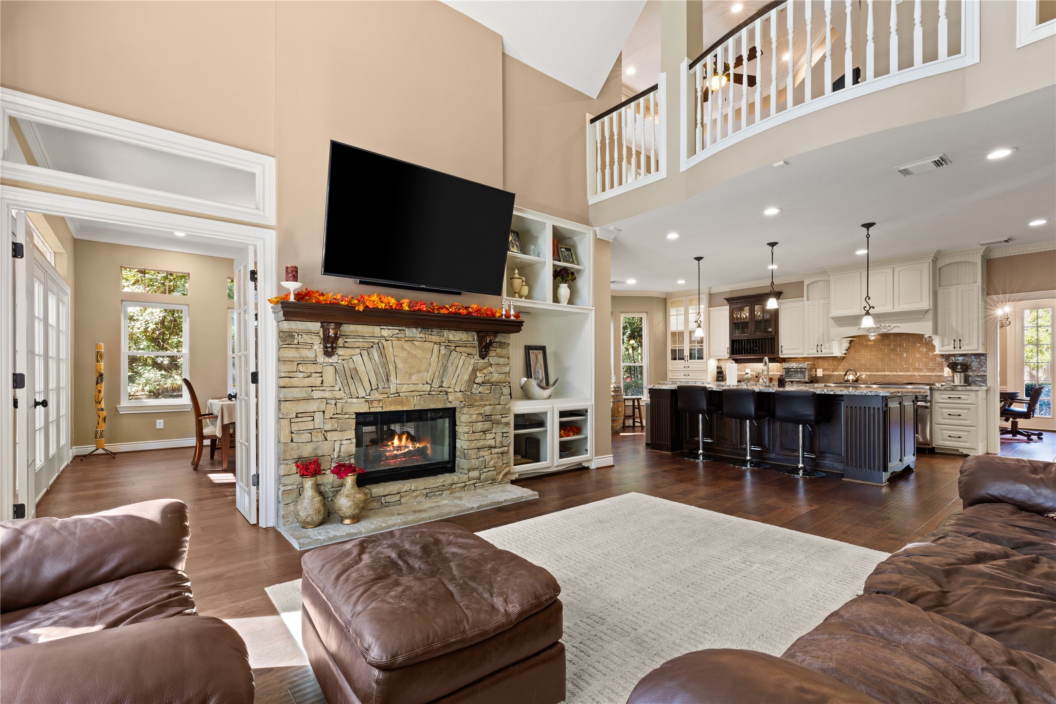 Open to kitchen. TV included. Fireplace fire has been digitally added for illustrative purposes.