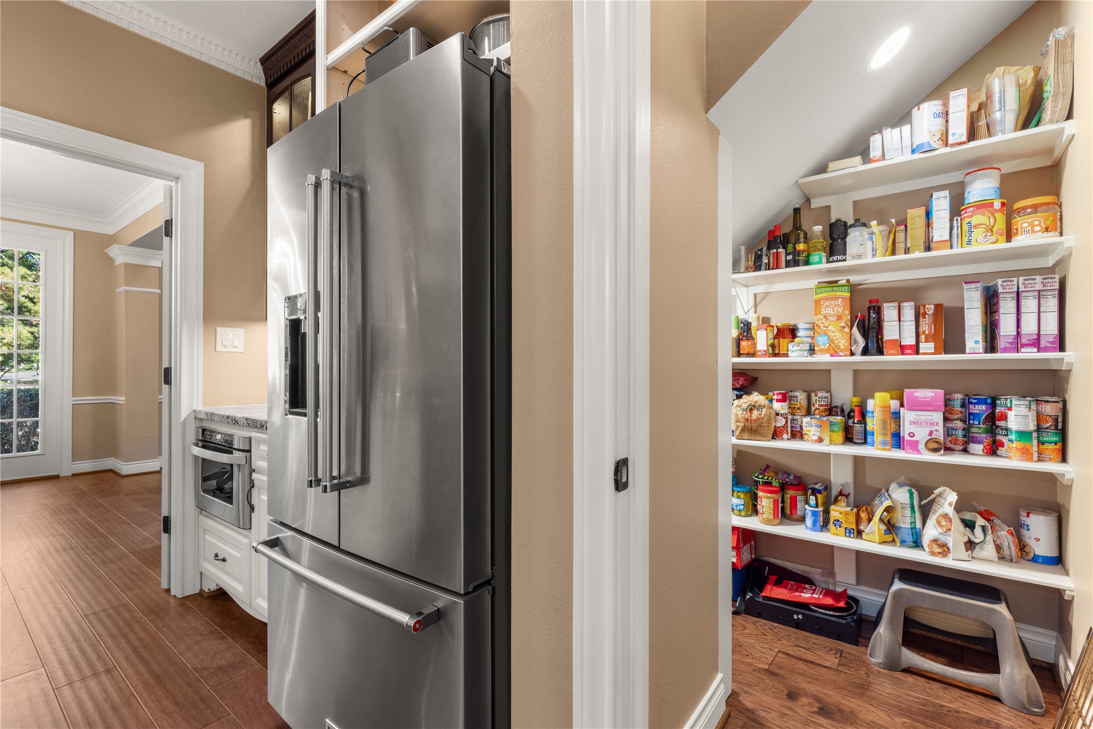 Stainless steel refrigerator included. Walk in pantry