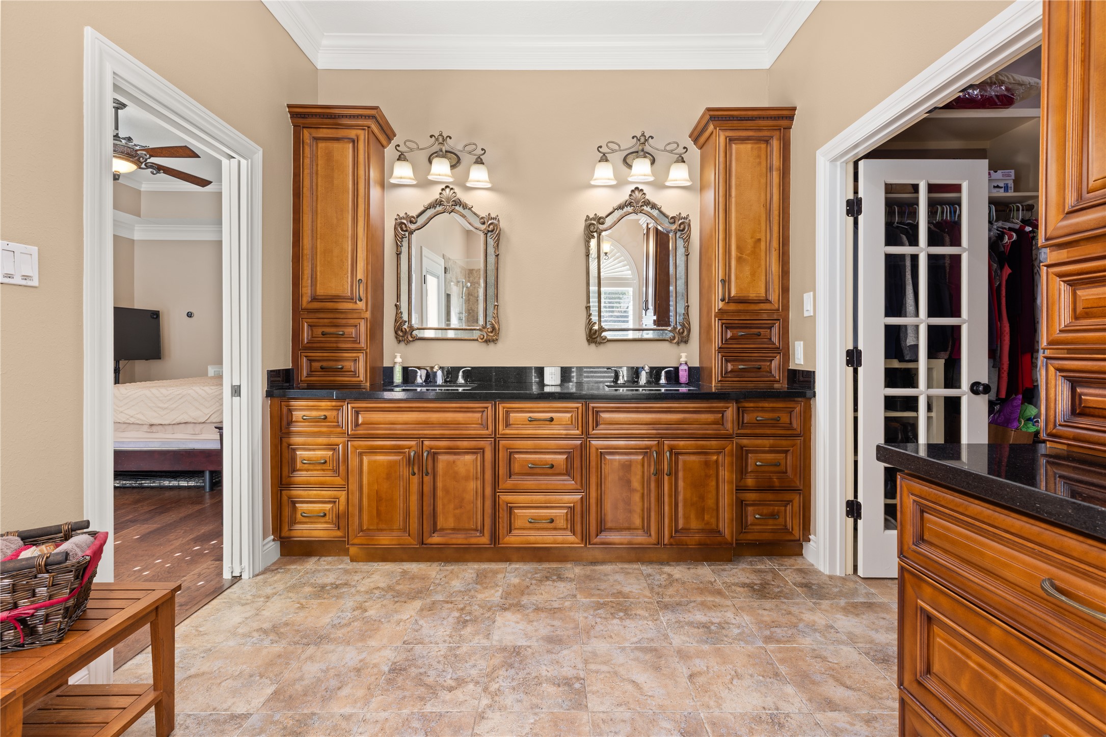 Primary bathroom with his/her sink and lots of built ins